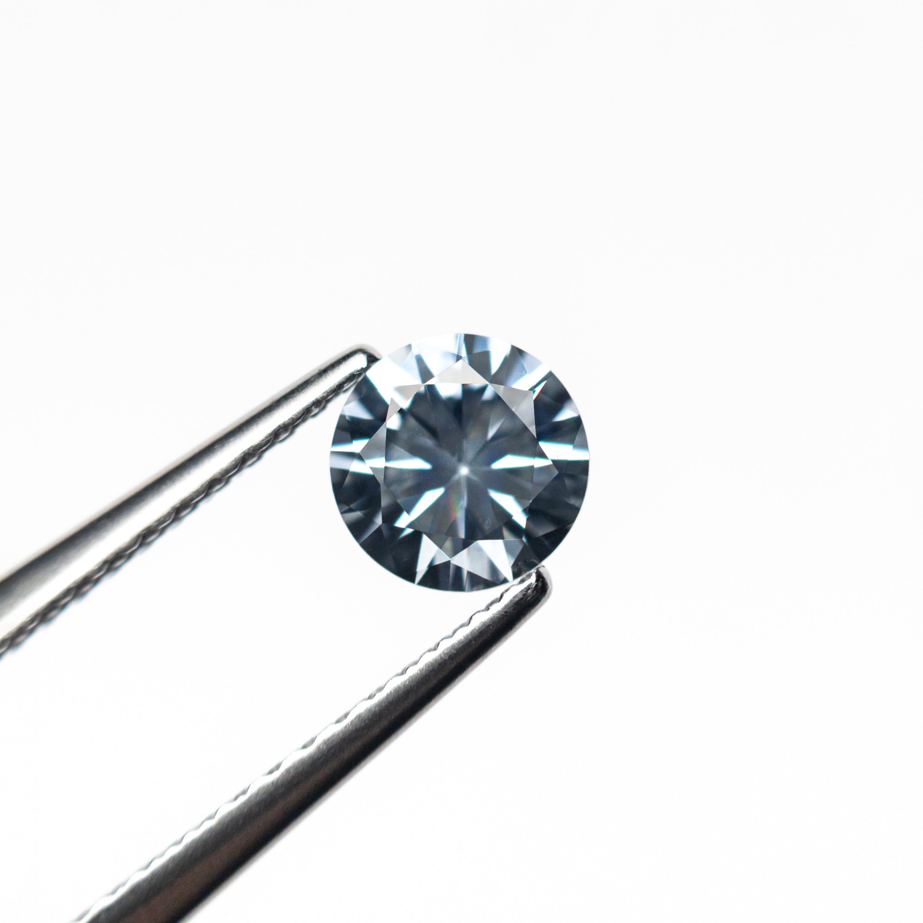 The 0.69ct 5.33x5.31x3.40mm Round Brilliant Sapphire 26766-12 by East London jeweller Rachel Boston | Discover our collections of unique and timeless engagement rings, wedding rings, and modern fine jewellery.