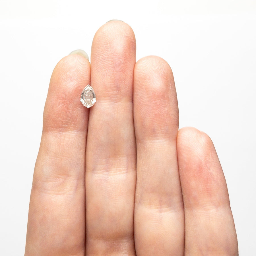 The 0.65ct 7.04x4.61x2.84mm Geo Pear Step Cut 🇨🇦 26846-01 by East London jeweller Rachel Boston | Discover our collections of unique and timeless engagement rings, wedding rings, and modern fine jewellery. - Rachel Boston Jewellery