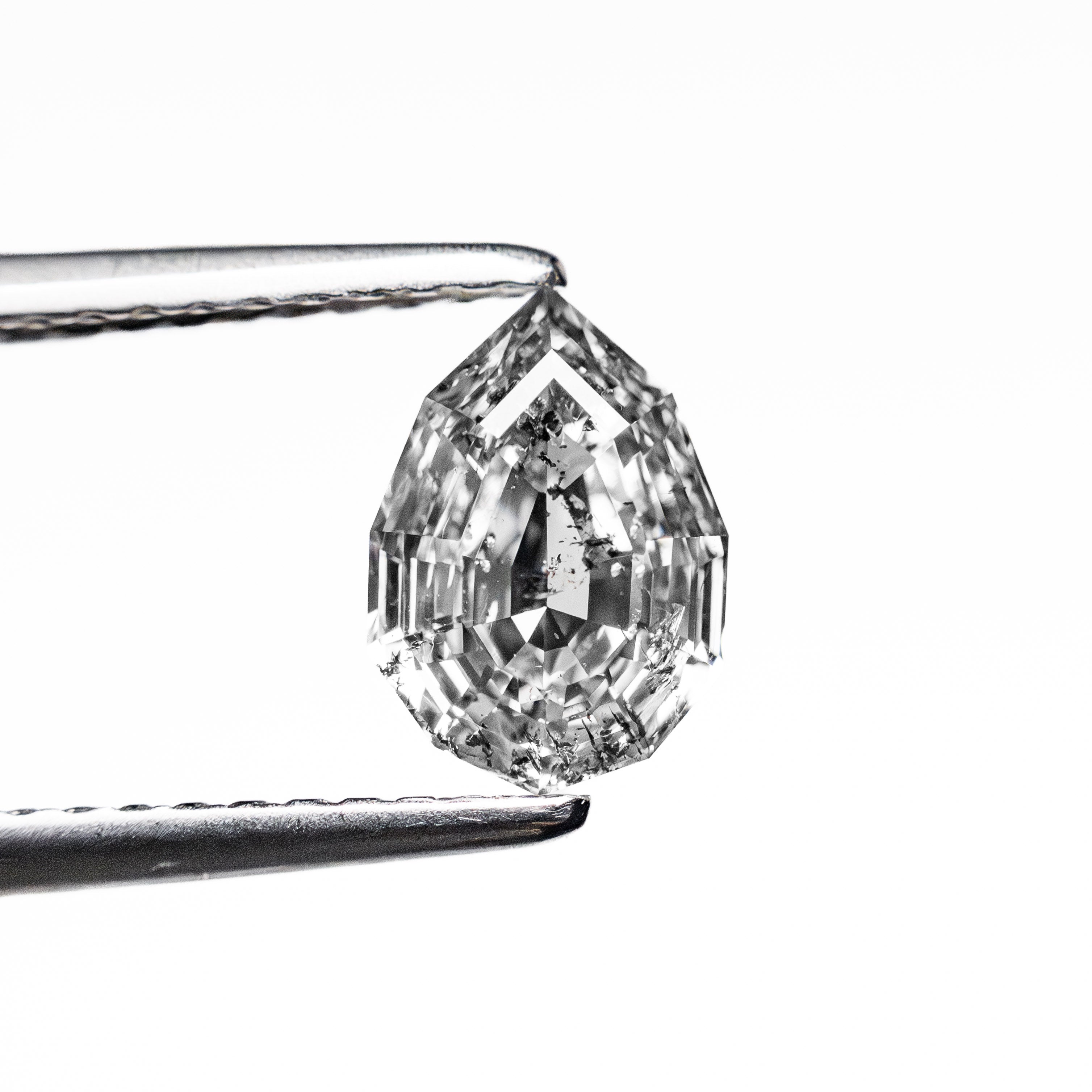 The 1.10ct 7.91x5.51x3.39mm Geo Pear Step Cut 🇨🇦 26879-01 by East London jeweller Rachel Boston | Discover our collections of unique and timeless engagement rings, wedding rings, and modern fine jewellery.