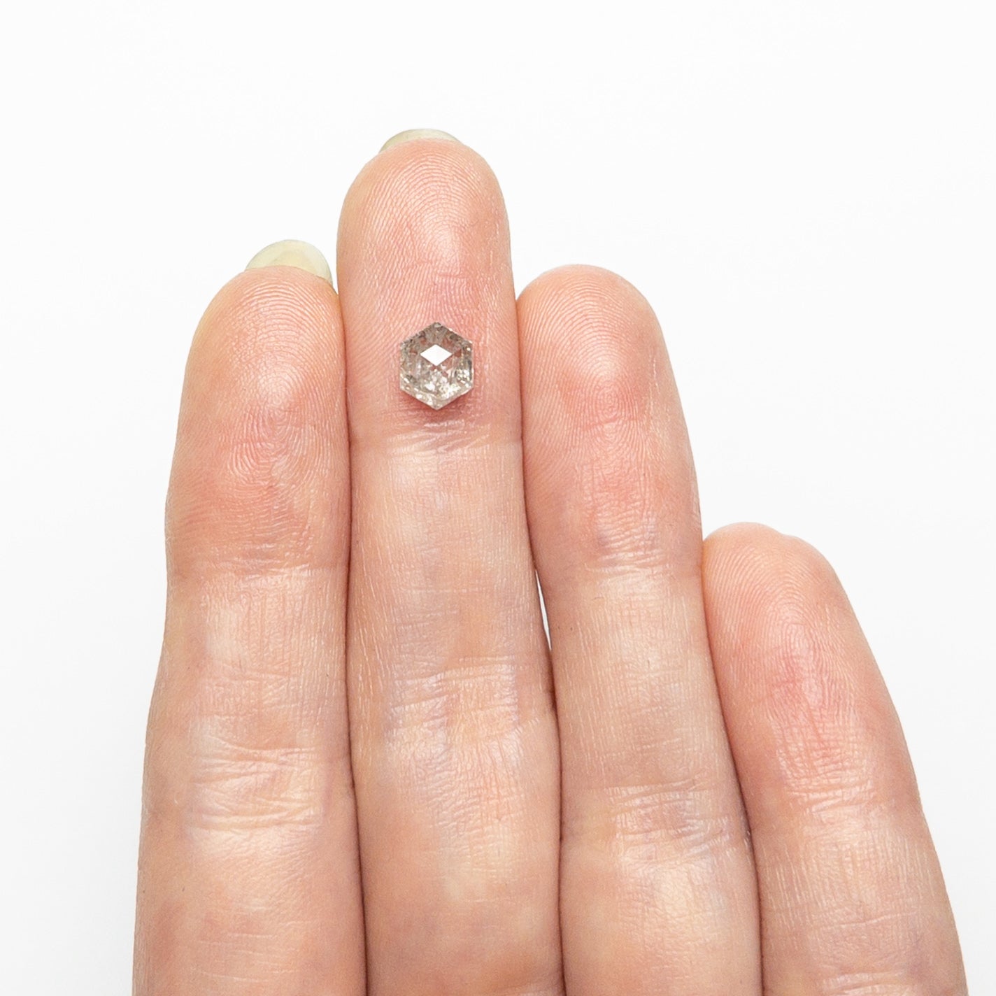 The 1.04ct 6.70x5.51x3.42mm Hexagon Step Cut 🇨🇦 26897-01 by East London jeweller Rachel Boston | Discover our collections of unique and timeless engagement rings, wedding rings, and modern fine jewellery.