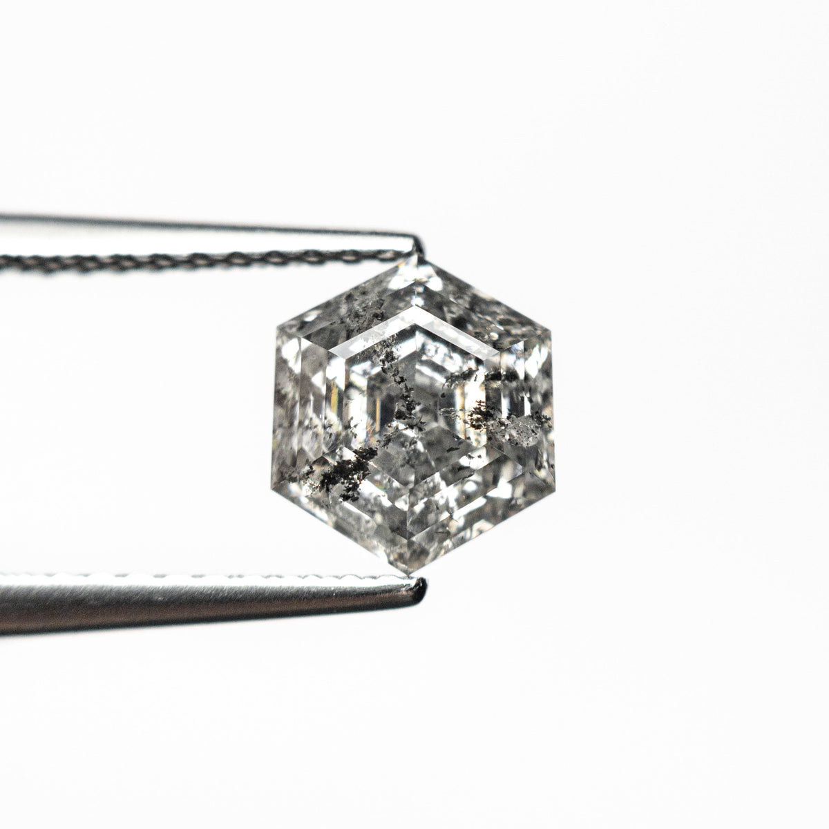 The 1.39ct 7.30x6.46x4.35mm Hexagon Step Cut 🇨🇦 26934-01 by East London jeweller Rachel Boston | Discover our collections of unique and timeless engagement rings, wedding rings, and modern fine jewellery.