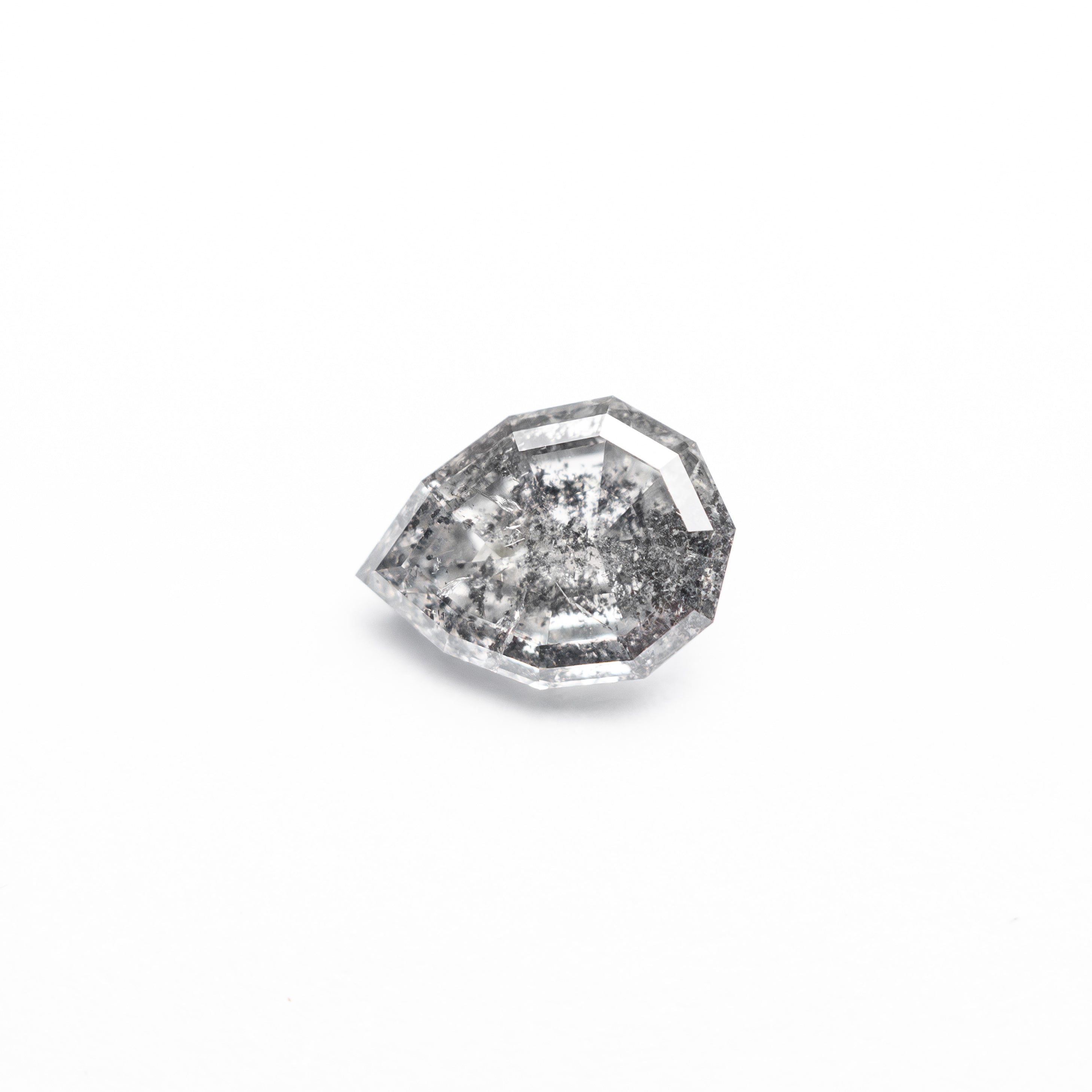 The 0.58ct 6.52x4.77x2.68mm Geo Pear Step Cut 🇨🇦 26952-01 by East London jeweller Rachel Boston | Discover our collections of unique and timeless engagement rings, wedding rings, and modern fine jewellery.