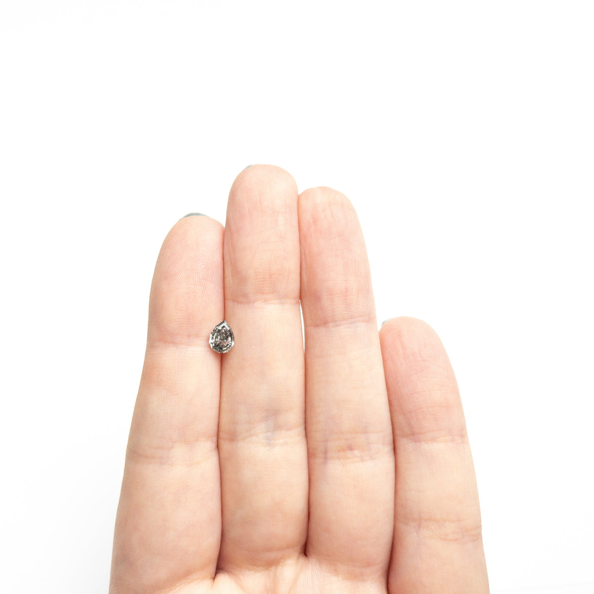 The 0.58ct 6.52x4.77x2.68mm Geo Pear Step Cut 🇨🇦 26952-01 by East London jeweller Rachel Boston | Discover our collections of unique and timeless engagement rings, wedding rings, and modern fine jewellery.