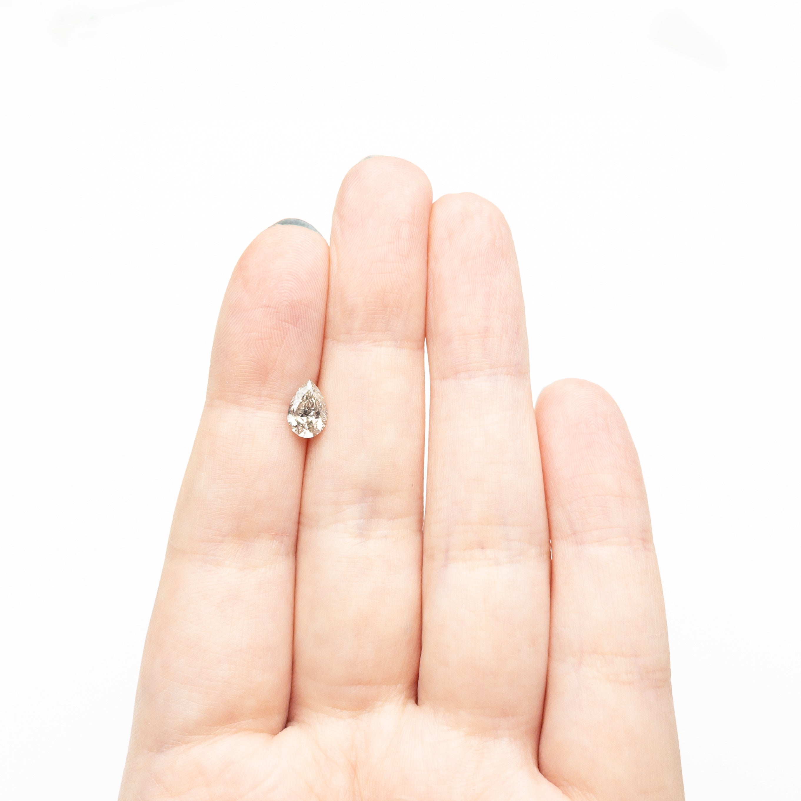 The 0.92ct 8.05x5.48x3.41mm Pear Brilliant 🇨🇦 26977-01 by East London jeweller Rachel Boston | Discover our collections of unique and timeless engagement rings, wedding rings, and modern fine jewellery.