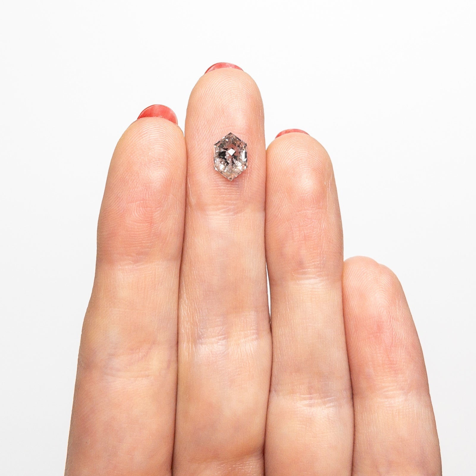 The 1.09ct 8.03x5.60x3.41mm Hexagon Step Cut 🇨🇦 26983-01 by East London jeweller Rachel Boston | Discover our collections of unique and timeless engagement rings, wedding rings, and modern fine jewellery.
