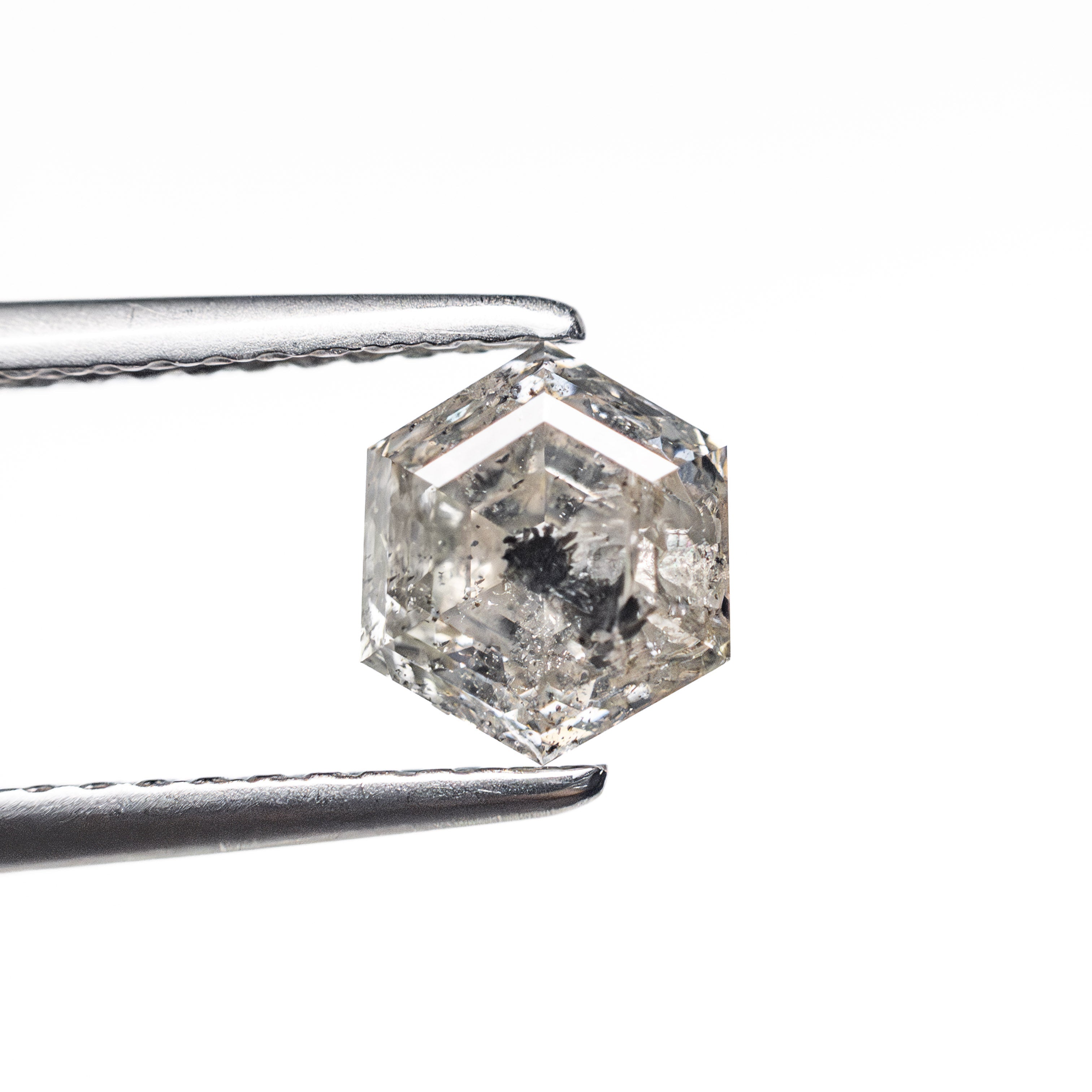 The 1.08ct 6.53x5.66x3.89mm Hexagon Step Cut 🇨🇦 27000-01 by East London jeweller Rachel Boston | Discover our collections of unique and timeless engagement rings, wedding rings, and modern fine jewellery.