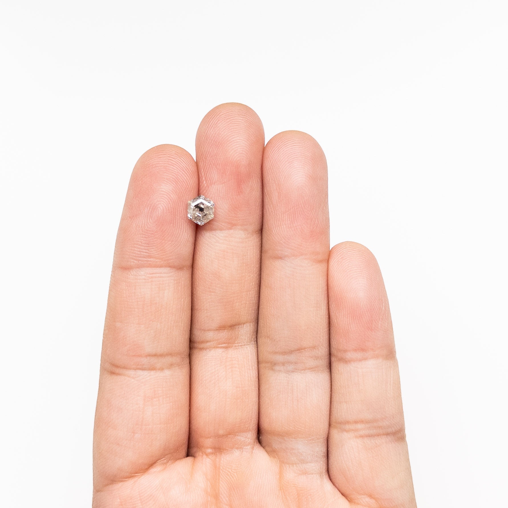 The 1.08ct 6.53x5.66x3.89mm Hexagon Step Cut 🇨🇦 27000-01 by East London jeweller Rachel Boston | Discover our collections of unique and timeless engagement rings, wedding rings, and modern fine jewellery.