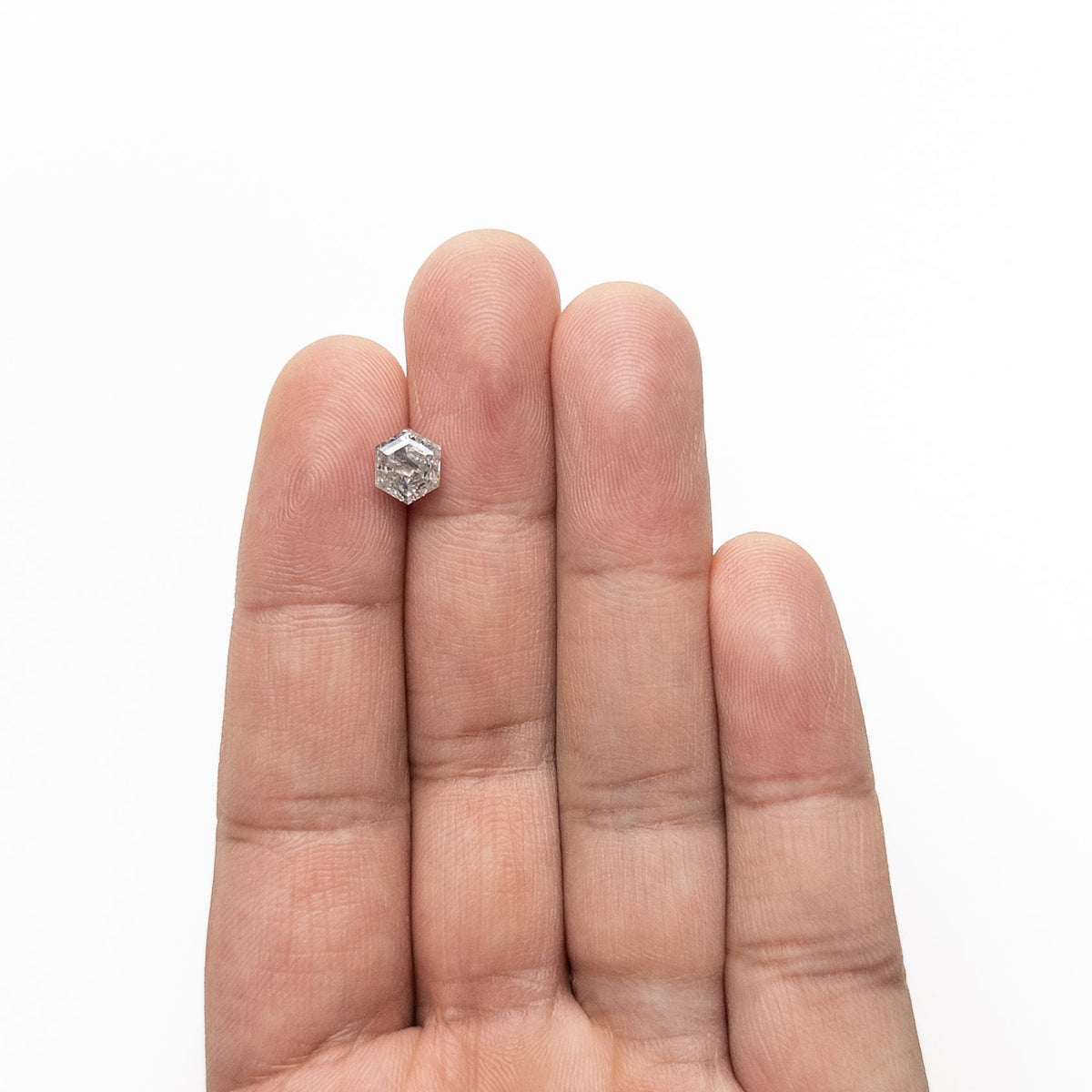 The 1.47ct 7.20x6.21x4.24mm Hexagon Step Cut 🇨🇦 27006-01 by East London jeweller Rachel Boston | Discover our collections of unique and timeless engagement rings, wedding rings, and modern fine jewellery.