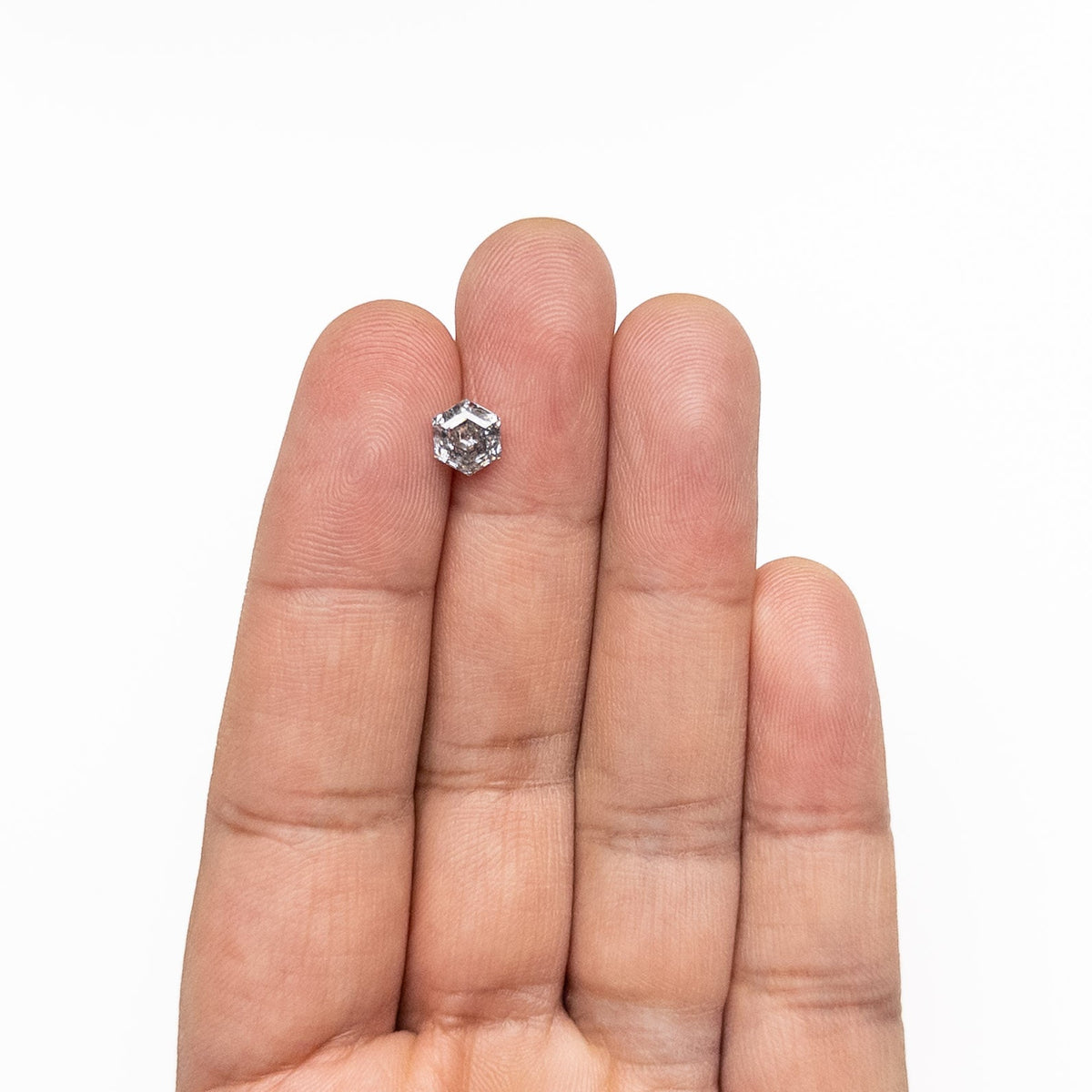 The 1.29ct 7.04x6.03x4.15mm Hexagon Step Cut 🇨🇦 27007-01 by East London jeweller Rachel Boston | Discover our collections of unique and timeless engagement rings, wedding rings, and modern fine jewellery.