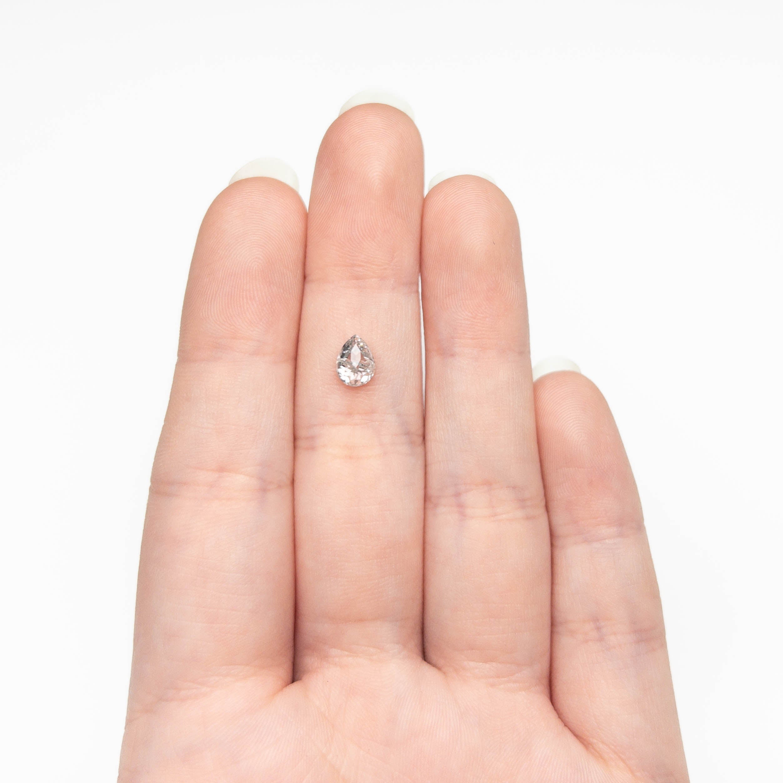 The 0.77ct 6.96x5.14x2.97mm Pear Brilliant 🇨🇦 27038-01 by East London jeweller Rachel Boston | Discover our collections of unique and timeless engagement rings, wedding rings, and modern fine jewellery.