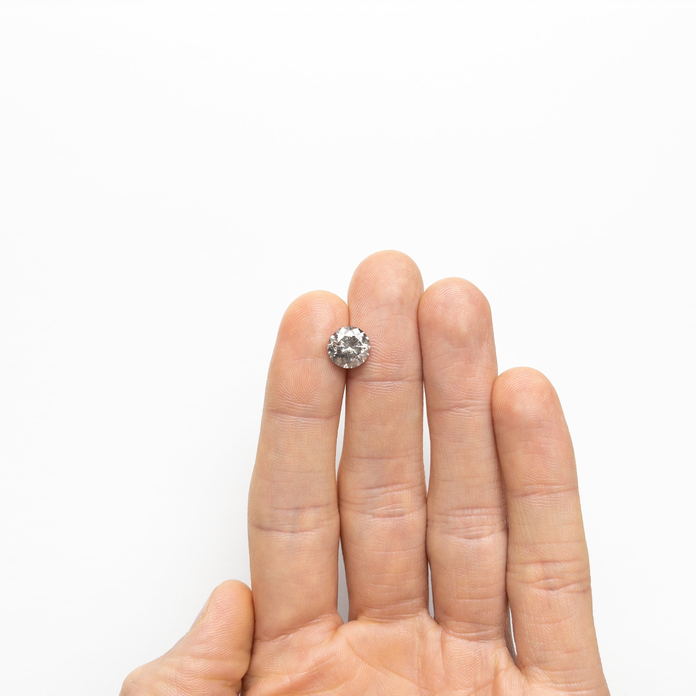 The 3.08ct 8.99x8.76x6.08mm Round Brilliant 27051-01 by East London jeweller Rachel Boston | Discover our collections of unique and timeless engagement rings, wedding rings, and modern fine jewellery.
