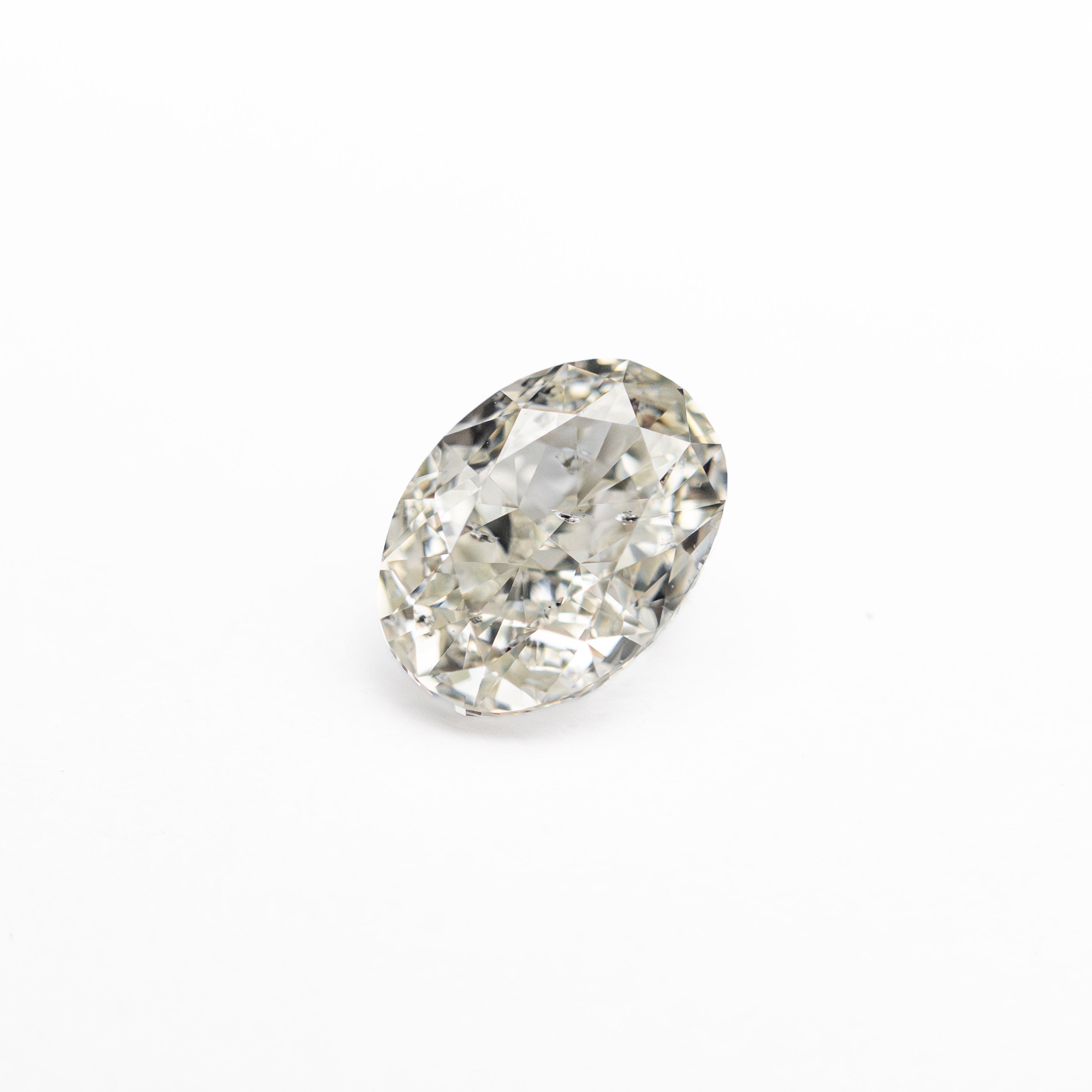 The 0.70ct 6.09x4.50x3.04mm SI2 K Oval Brilliant 27065-05 by East London jeweller Rachel Boston | Discover our collections of unique and timeless engagement rings, wedding rings, and modern fine jewellery.