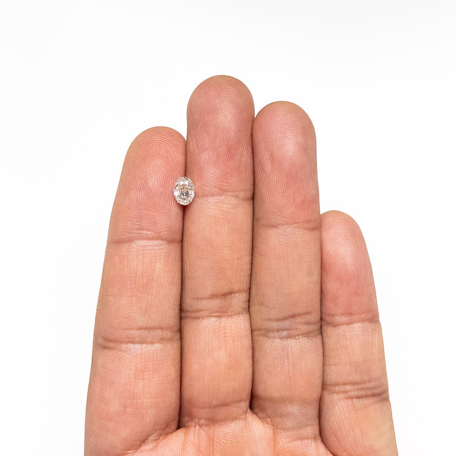 The 0.70ct 6.09x4.50x3.04mm SI2 K Oval Brilliant 27065-05 by East London jeweller Rachel Boston | Discover our collections of unique and timeless engagement rings, wedding rings, and modern fine jewellery. - Rachel Boston Jewellery