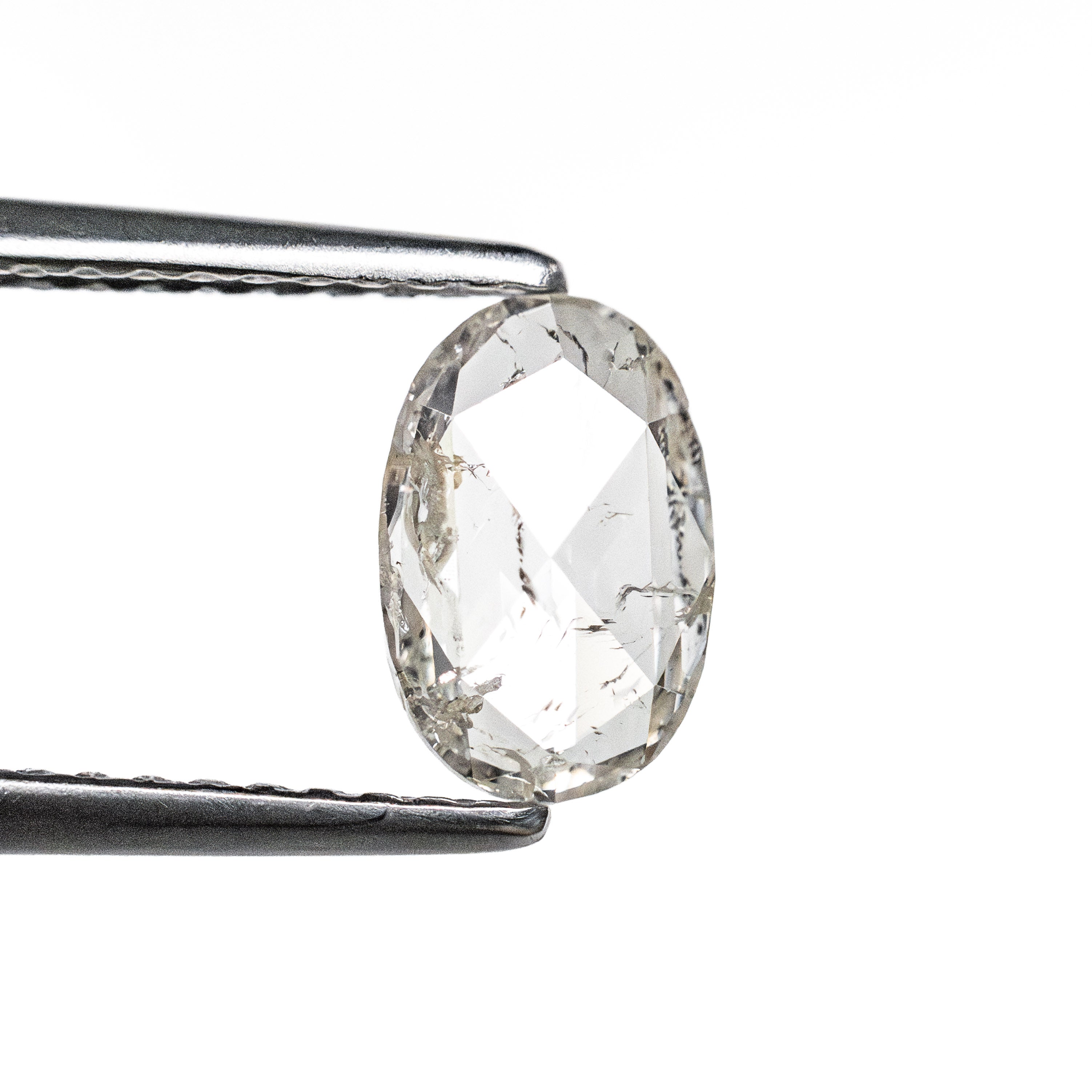 The 0.86ct 7.87x5.21x2.19mm I2 M Oval Rosecut 27066-05 by East London jeweller Rachel Boston | Discover our collections of unique and timeless engagement rings, wedding rings, and modern fine jewellery.