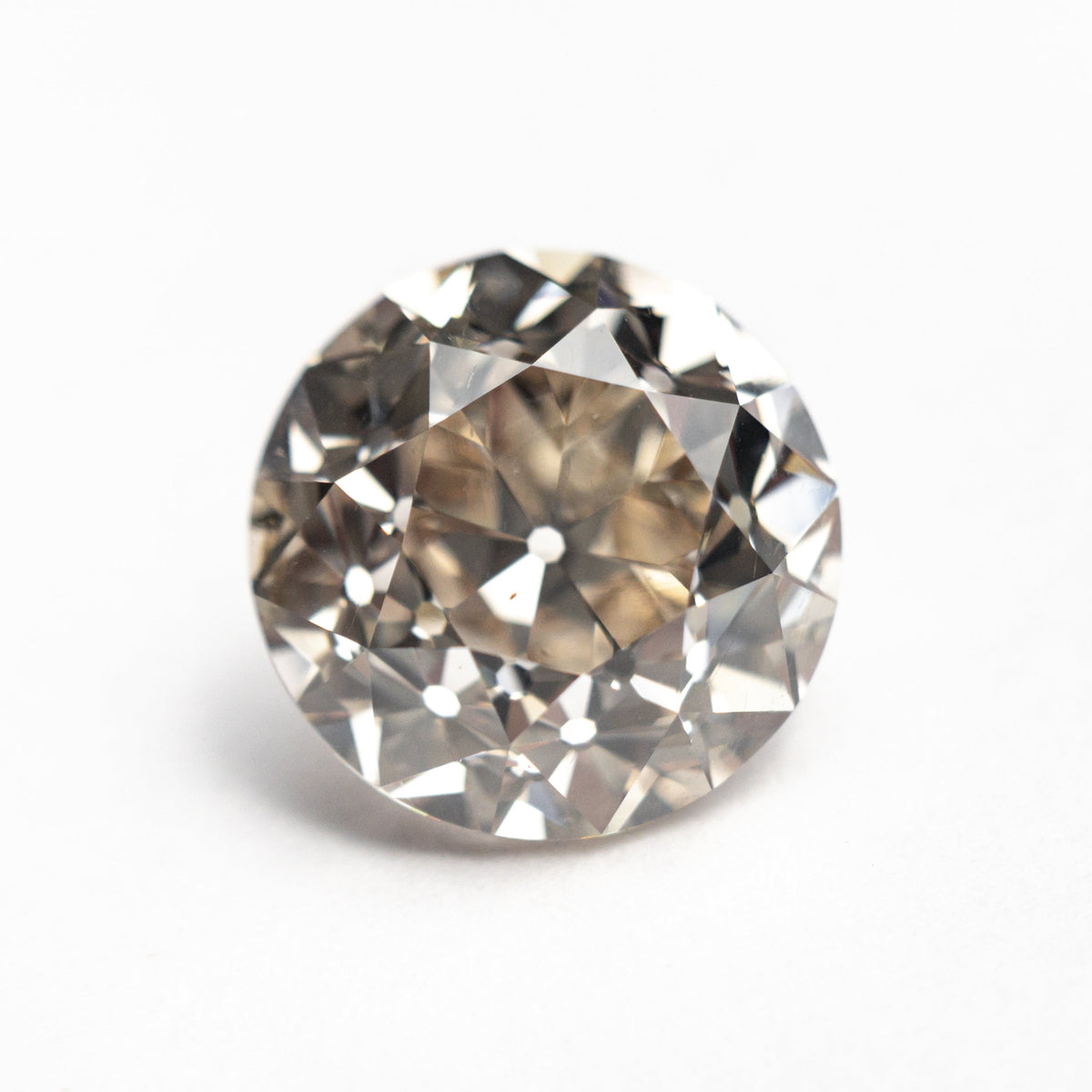 The 5.10ct 10.30x10.26x7.27mm GIA SI1 Q-R Modern Antique Old European Cut 27077-01 by East London jeweller Rachel Boston | Discover our collections of unique and timeless engagement rings, wedding rings, and modern fine jewellery.
