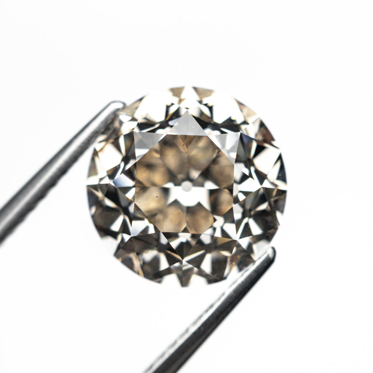 The 5.10ct 10.30x10.26x7.27mm GIA SI1 Q-R Modern Antique Old European Cut 27077-01 by East London jeweller Rachel Boston | Discover our collections of unique and timeless engagement rings, wedding rings, and modern fine jewellery.