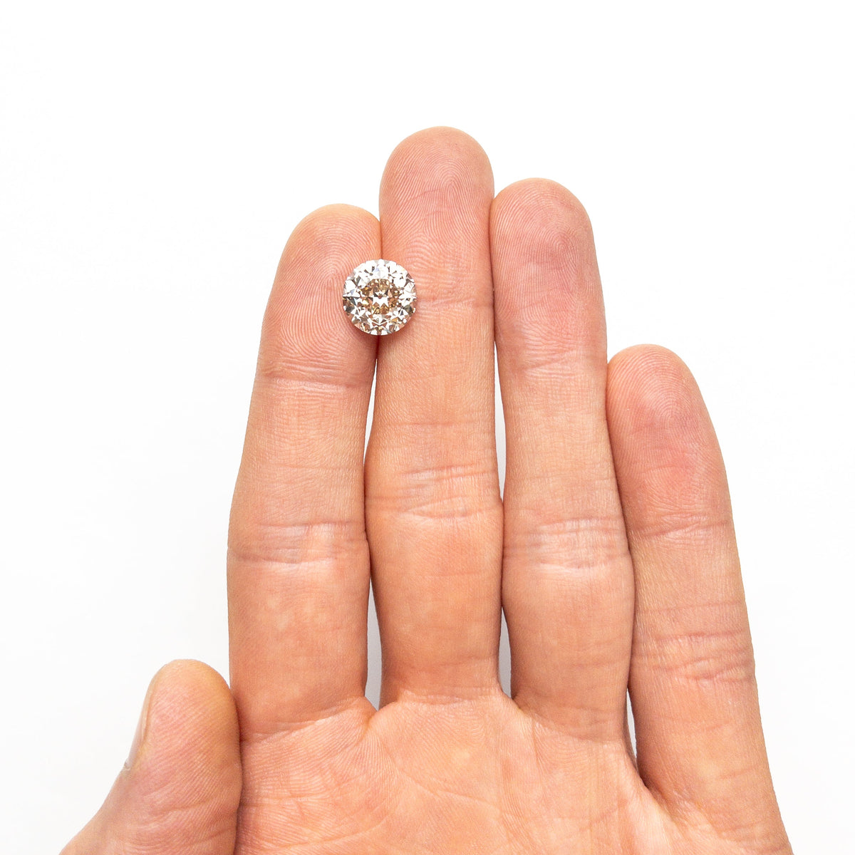 The 5.10ct 10.30x10.26x7.27mm GIA SI1 Q-R Modern Antique Old European Cut 27077-01 by East London jeweller Rachel Boston | Discover our collections of unique and timeless engagement rings, wedding rings, and modern fine jewellery.