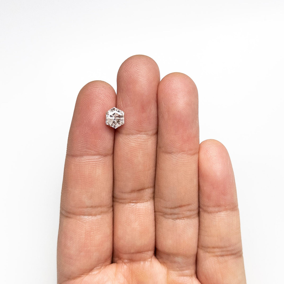 The 1.78ct 7.47x6.42x4.78mm Hexagon Step Cut 🇨🇦 27278-01 by East London jeweller Rachel Boston | Discover our collections of unique and timeless engagement rings, wedding rings, and modern fine jewellery.