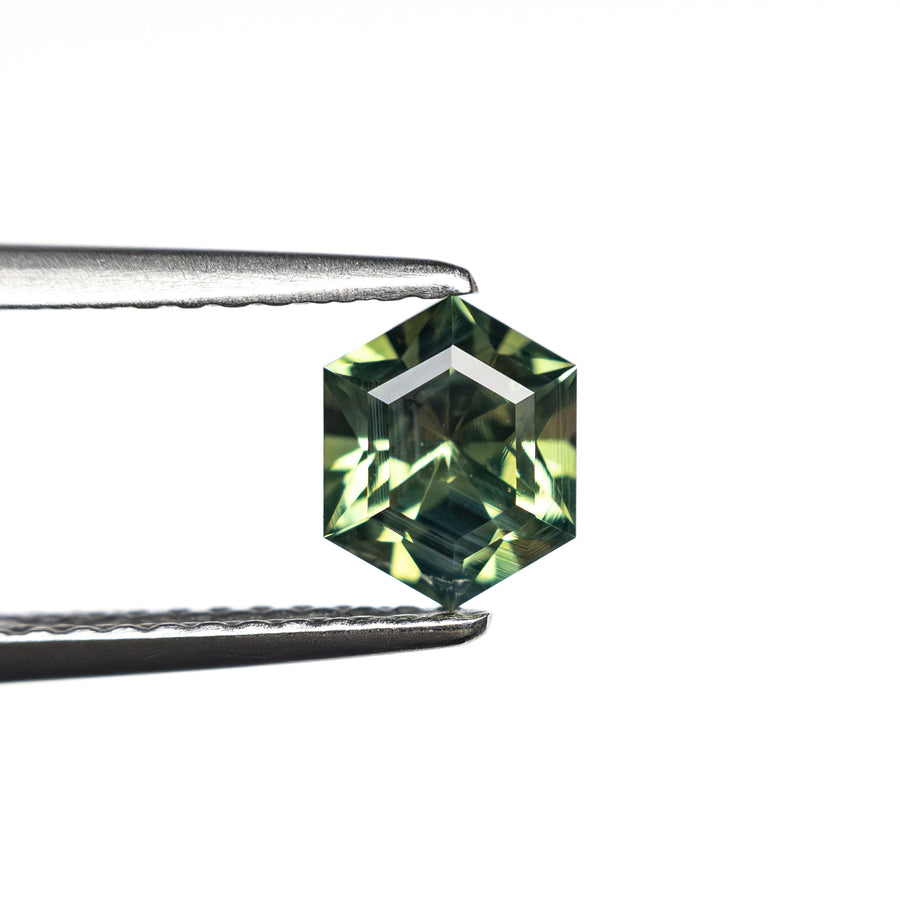 The 0.79ct 6.40x5.15x3.49mm Hexagon Step Cut Sapphire 27336-02 by East London jeweller Rachel Boston | Discover our collections of unique and timeless engagement rings, wedding rings, and modern fine jewellery. - Rachel Boston Jewellery