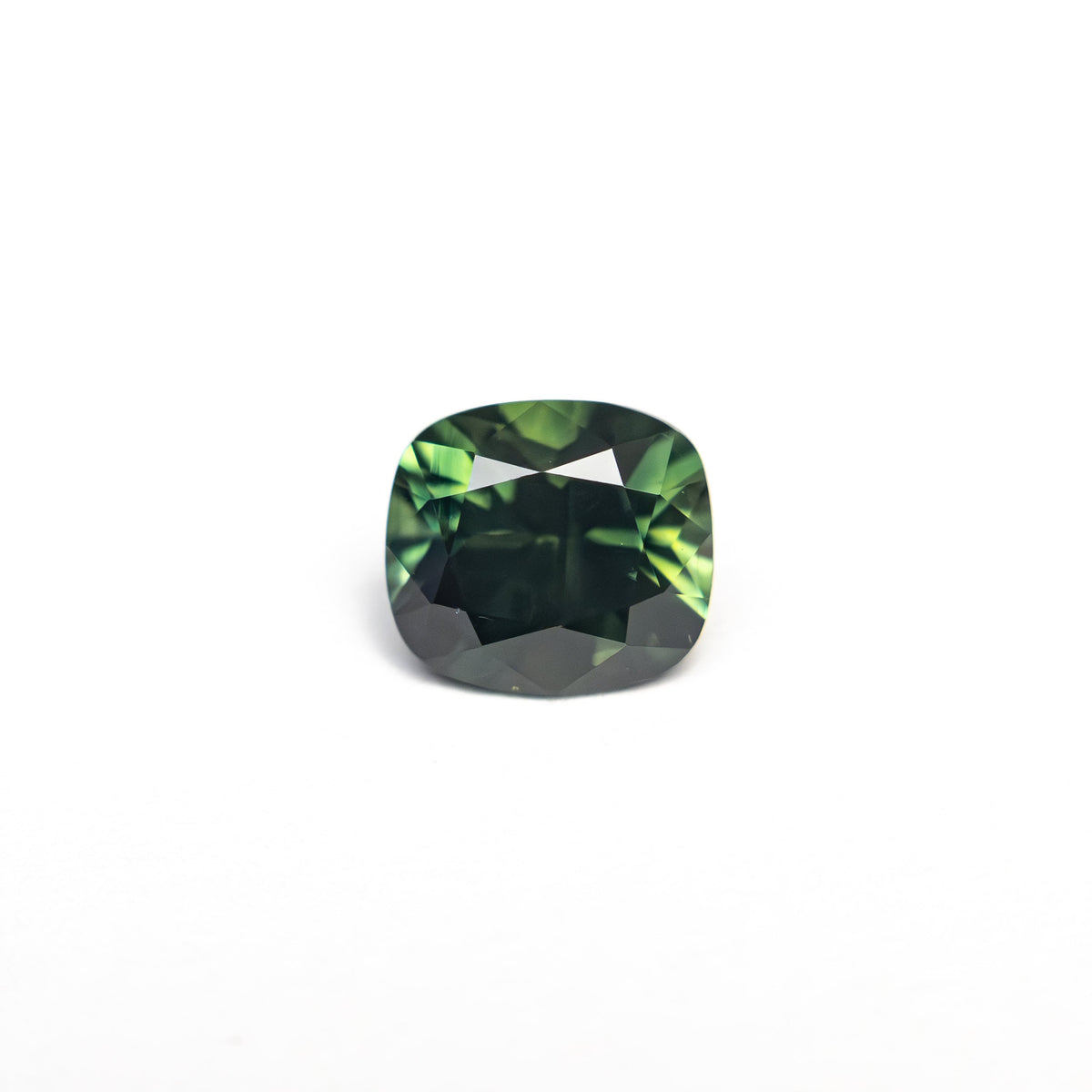 The 0.83ct 5.59x4.48x3.74mm Cushion Brilliant Sapphire 27336-09 by East London jeweller Rachel Boston | Discover our collections of unique and timeless engagement rings, wedding rings, and modern fine jewellery.