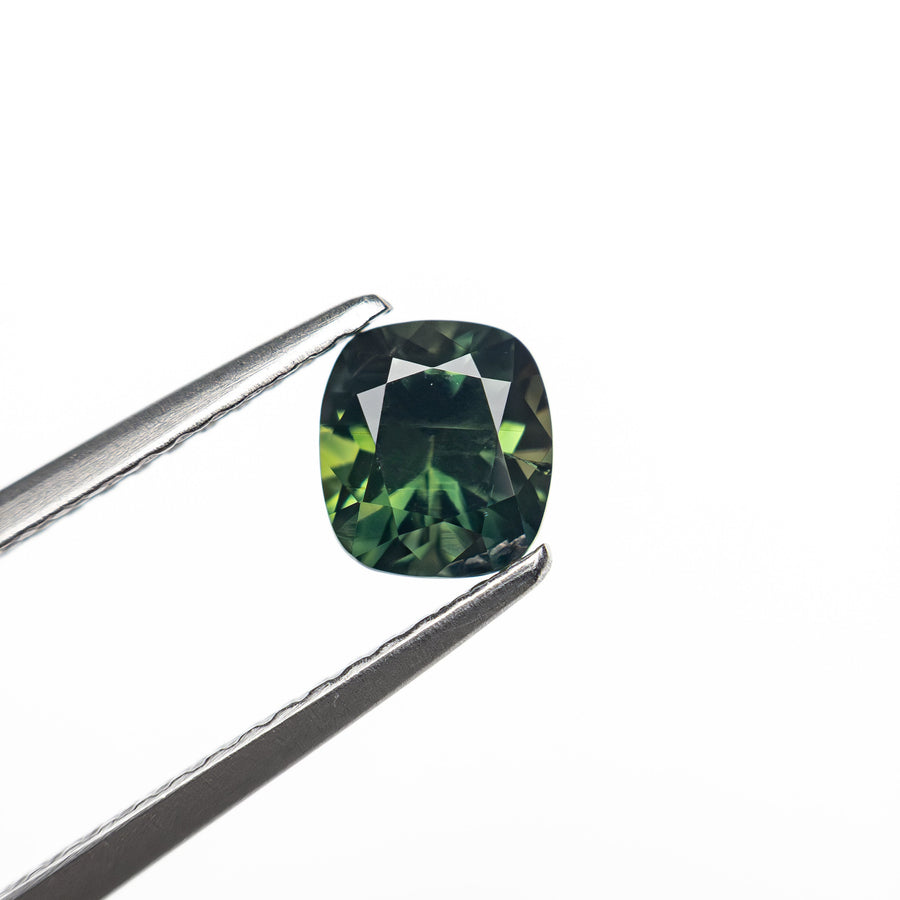 The 0.83ct 5.59x4.48x3.74mm Cushion Brilliant Sapphire 27336-09 by East London jeweller Rachel Boston | Discover our collections of unique and timeless engagement rings, wedding rings, and modern fine jewellery. - Rachel Boston Jewellery