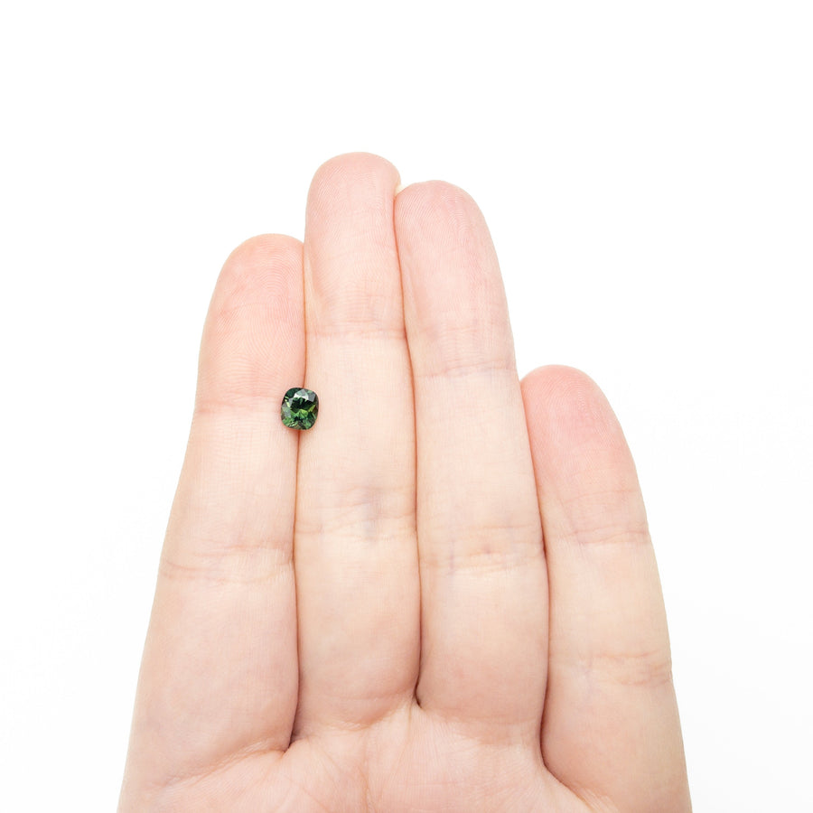 The 0.83ct 5.59x4.48x3.74mm Cushion Brilliant Sapphire 27336-09 by East London jeweller Rachel Boston | Discover our collections of unique and timeless engagement rings, wedding rings, and modern fine jewellery. - Rachel Boston Jewellery