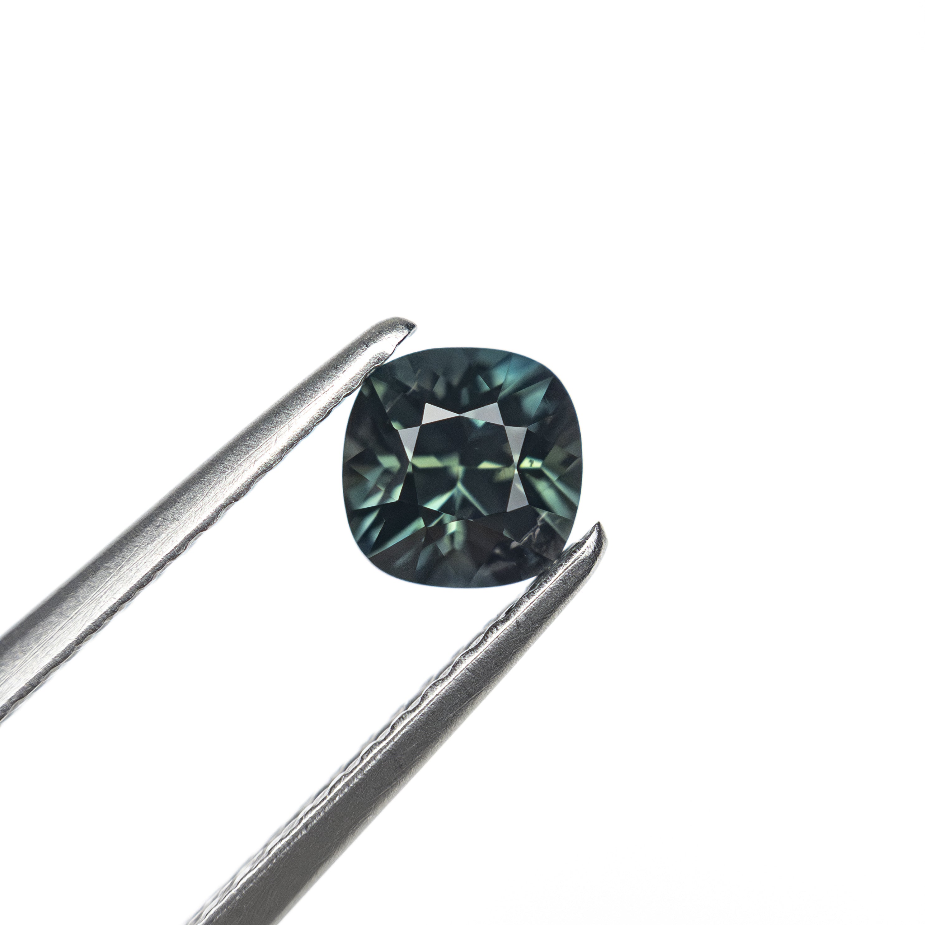 The 0.63ct 4.92x4.91x3.52mm Cushion Brilliant Sapphire 27336-13 by East London jeweller Rachel Boston | Discover our collections of unique and timeless engagement rings, wedding rings, and modern fine jewellery.