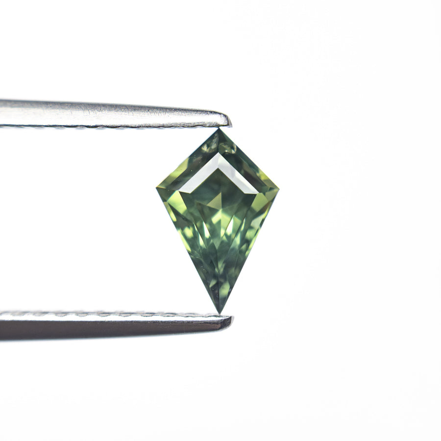 The 0.67ct 7.58x5.02x3.65mm Kite Step Cut Sapphire 27336-16 by East London jeweller Rachel Boston | Discover our collections of unique and timeless engagement rings, wedding rings, and modern fine jewellery. - Rachel Boston Jewellery