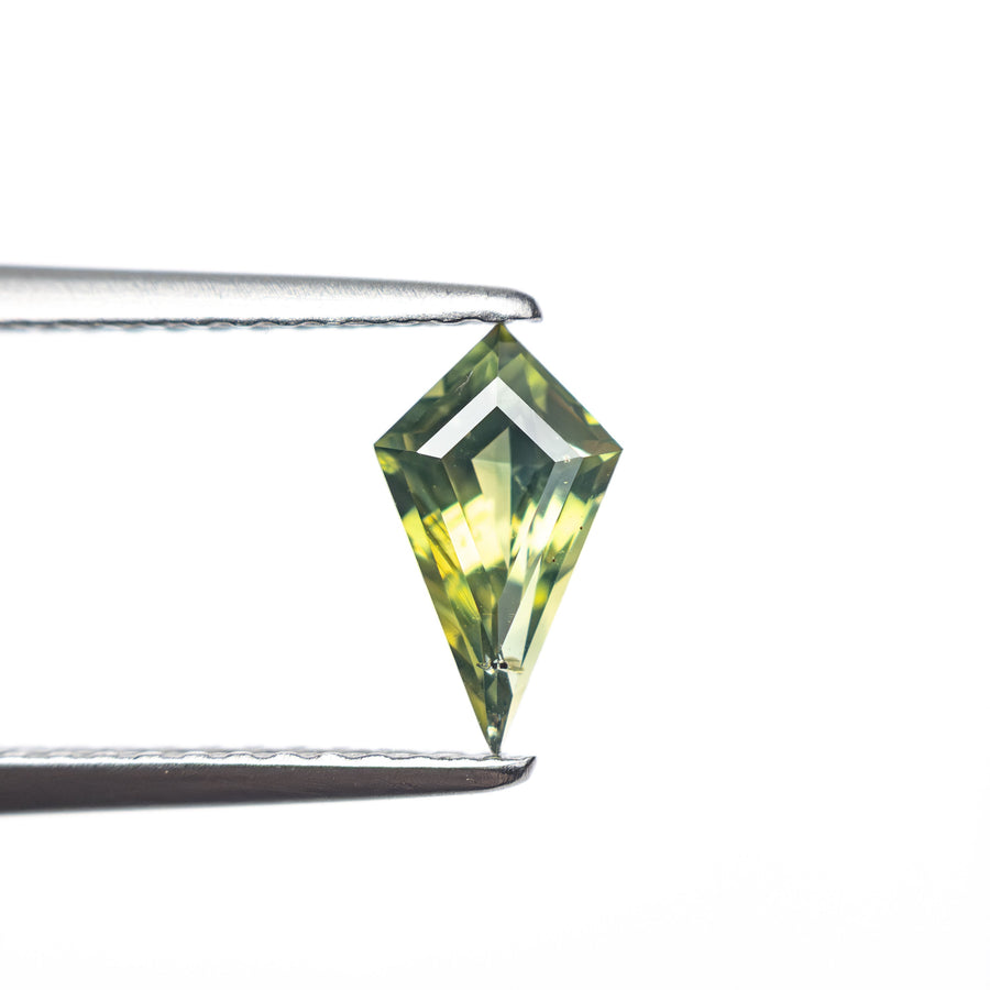 The 0.60ct 8.29x4.45x3.00mm Kite Step Cut Sapphire 27336-17 by East London jeweller Rachel Boston | Discover our collections of unique and timeless engagement rings, wedding rings, and modern fine jewellery. - Rachel Boston Jewellery
