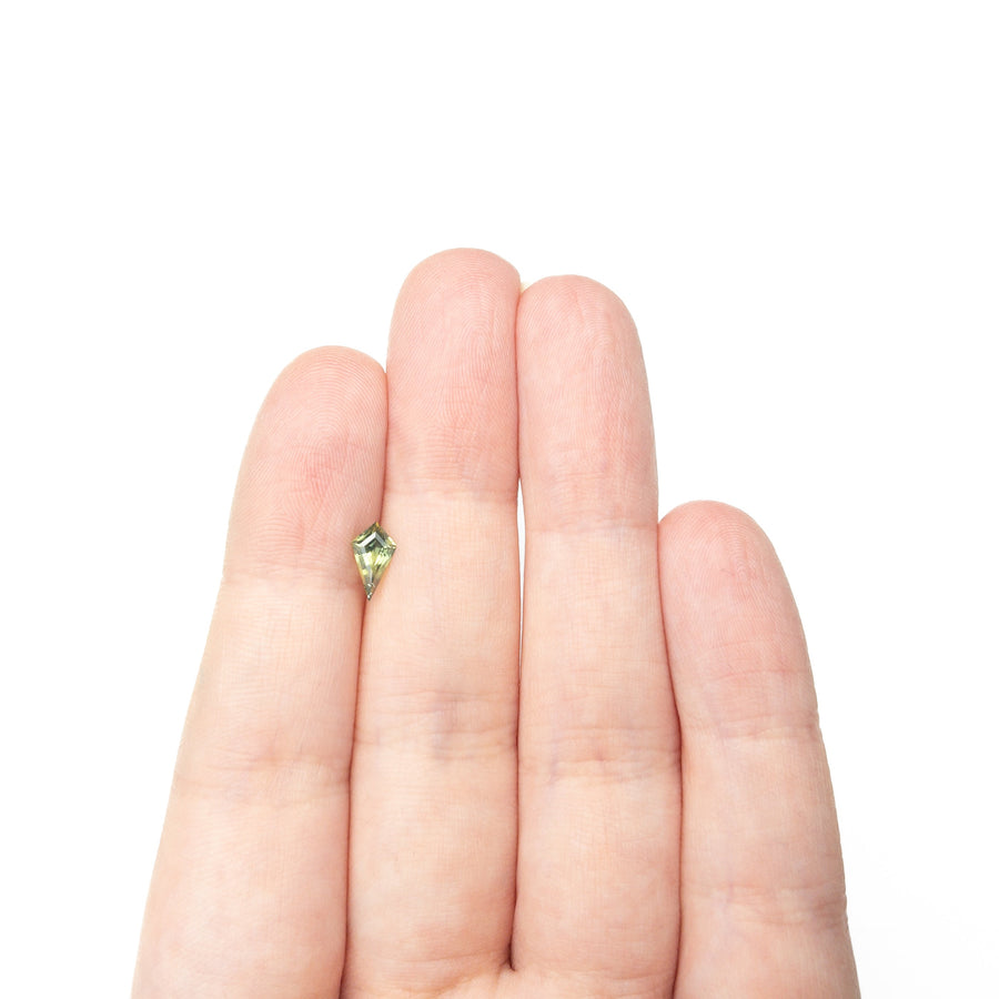 The 0.60ct 8.29x4.45x3.00mm Kite Step Cut Sapphire 27336-17 by East London jeweller Rachel Boston | Discover our collections of unique and timeless engagement rings, wedding rings, and modern fine jewellery. - Rachel Boston Jewellery