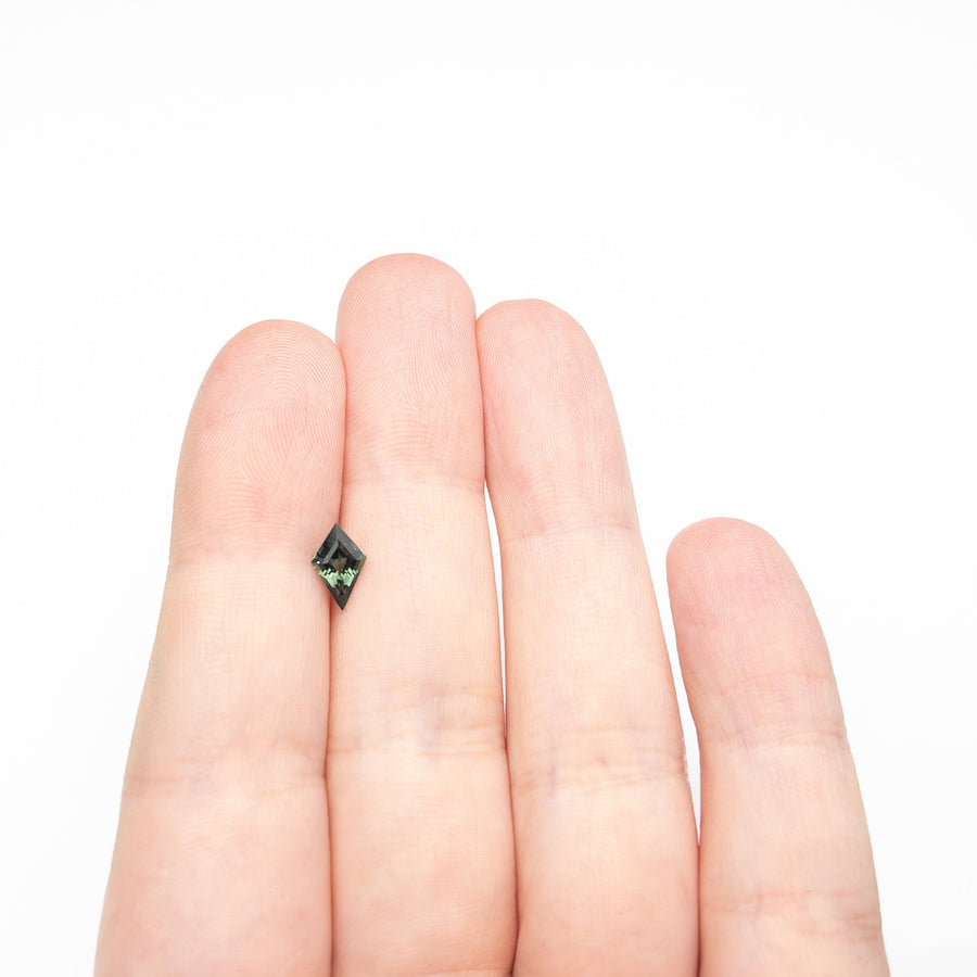 The 0.70ct 8.41x5.25x3.13mm Kite Step Cut Sapphire 27336-18 by East London jeweller Rachel Boston | Discover our collections of unique and timeless engagement rings, wedding rings, and modern fine jewellery. - Rachel Boston Jewellery