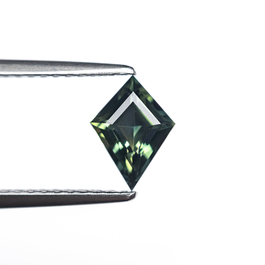 The 0.66ct 7.66x4.86x3.08mm Kite Step Cut Sapphire 27336-24 by East London jeweller Rachel Boston | Discover our collections of unique and timeless engagement rings, wedding rings, and modern fine jewellery. - Rachel Boston Jewellery