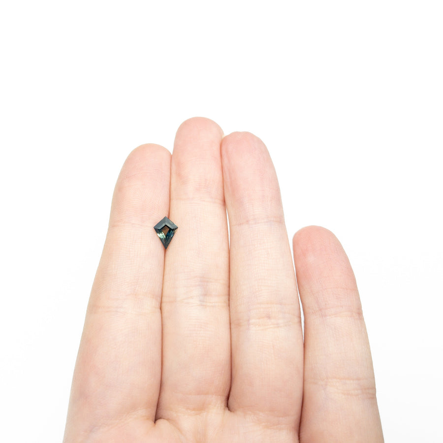 The 0.88ct 8.23x5.55x3.22mm Kite Step Cut Sapphire 27336-25 by East London jeweller Rachel Boston | Discover our collections of unique and timeless engagement rings, wedding rings, and modern fine jewellery. - Rachel Boston Jewellery