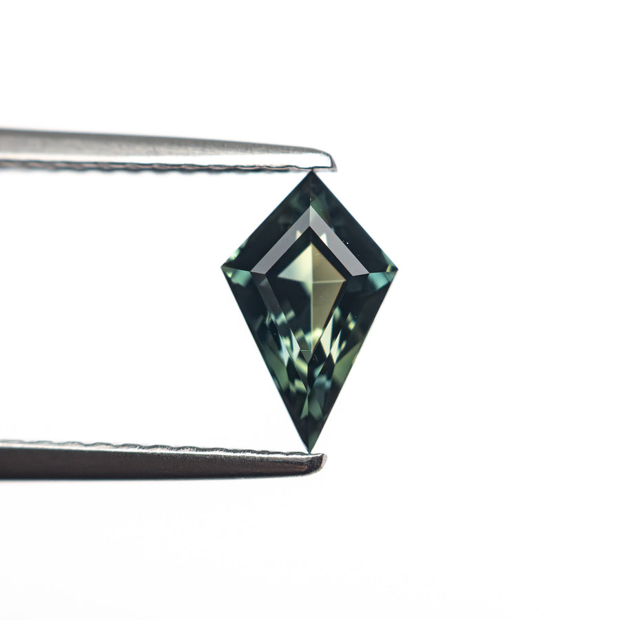 The 0.79ct 8.27x4.78x3.40mm Kite Step Cut Sapphire 27336-26 by East London jeweller Rachel Boston | Discover our collections of unique and timeless engagement rings, wedding rings, and modern fine jewellery. - Rachel Boston Jewellery