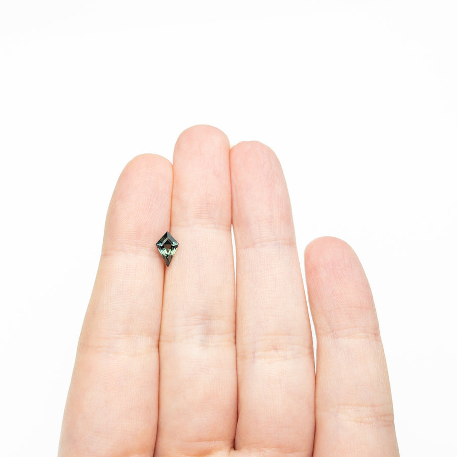 The 0.79ct 8.27x4.78x3.40mm Kite Step Cut Sapphire 27336-26 by East London jeweller Rachel Boston | Discover our collections of unique and timeless engagement rings, wedding rings, and modern fine jewellery. - Rachel Boston Jewellery