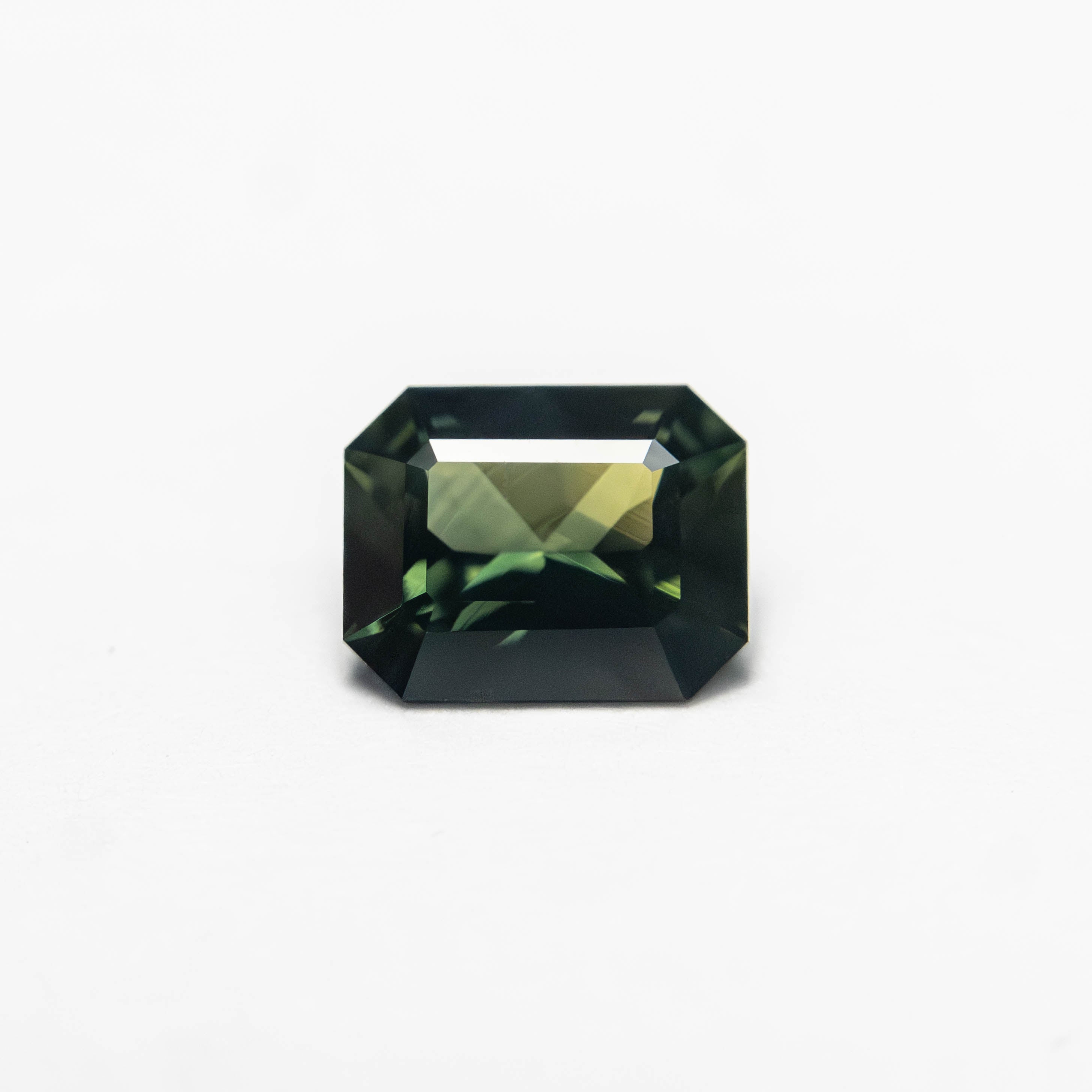 The 0.69ct 5.89x4.67x2.82mm Cut Corner Rectangle Step Cut Sapphire 27336-28 by East London jeweller Rachel Boston | Discover our collections of unique and timeless engagement rings, wedding rings, and modern fine jewellery.