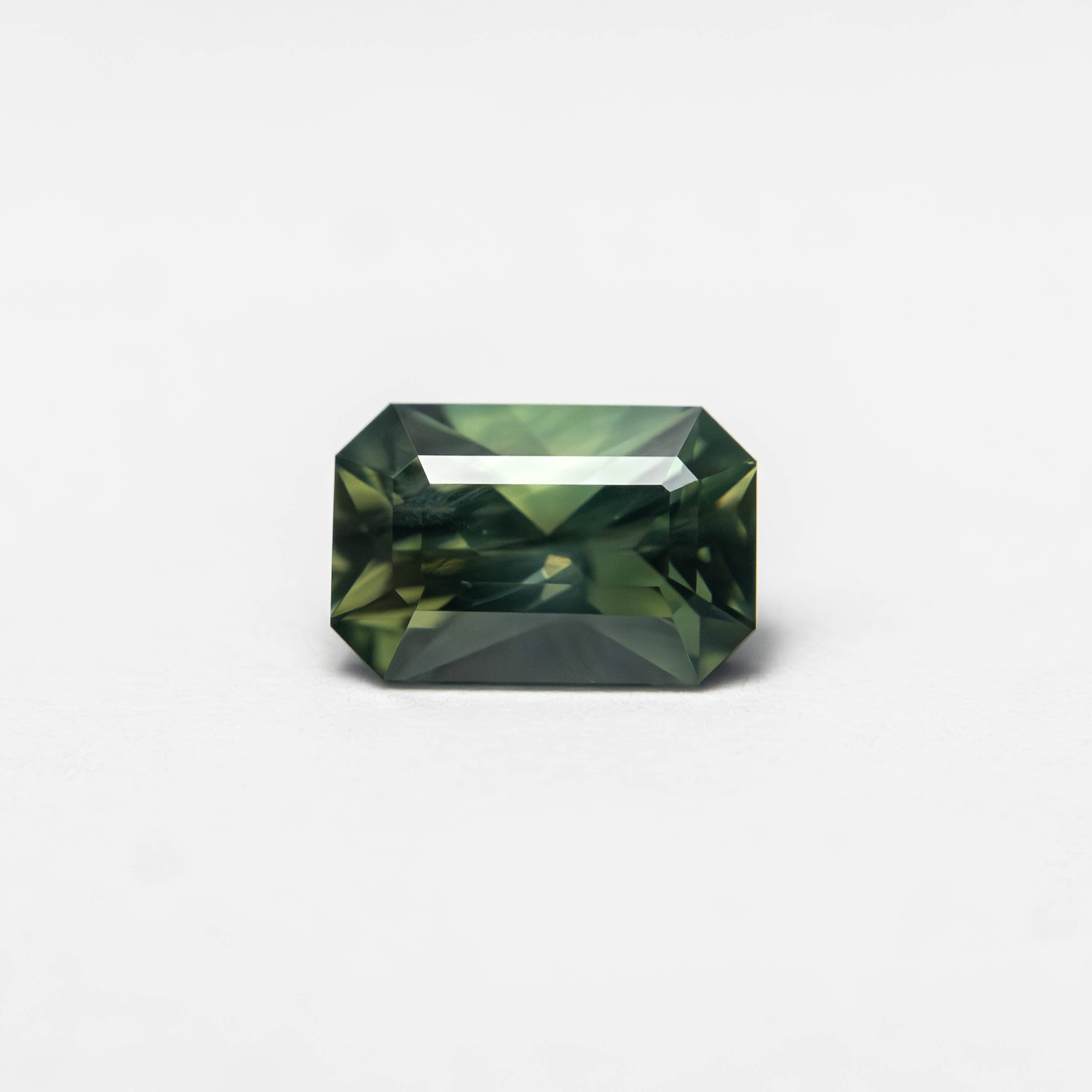 The 0.82ct 6.36x4.23x3.53mm Cut Corner Rectangle Step Cut Sapphire 27336-37 by East London jeweller Rachel Boston | Discover our collections of unique and timeless engagement rings, wedding rings, and modern fine jewellery.