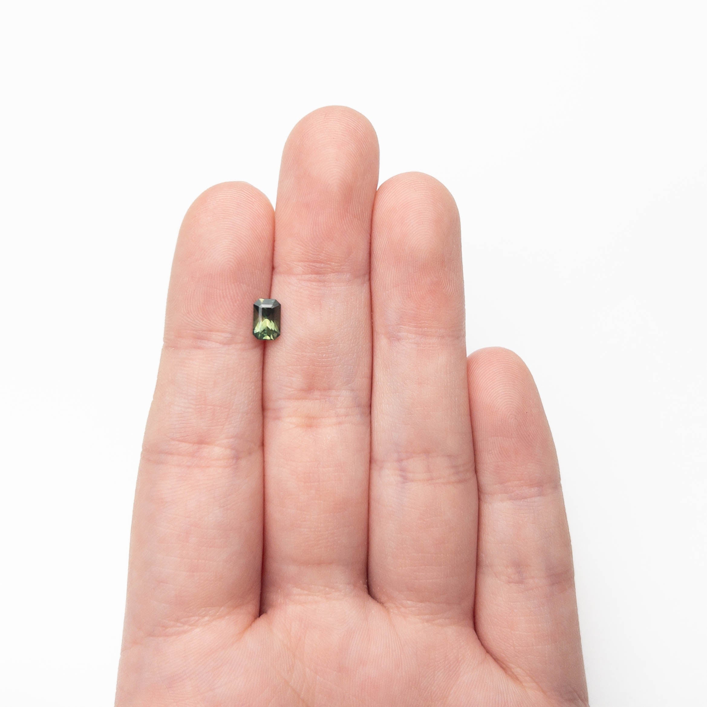 The 0.82ct 6.36x4.23x3.53mm Cut Corner Rectangle Step Cut Sapphire 27336-37 by East London jeweller Rachel Boston | Discover our collections of unique and timeless engagement rings, wedding rings, and modern fine jewellery.