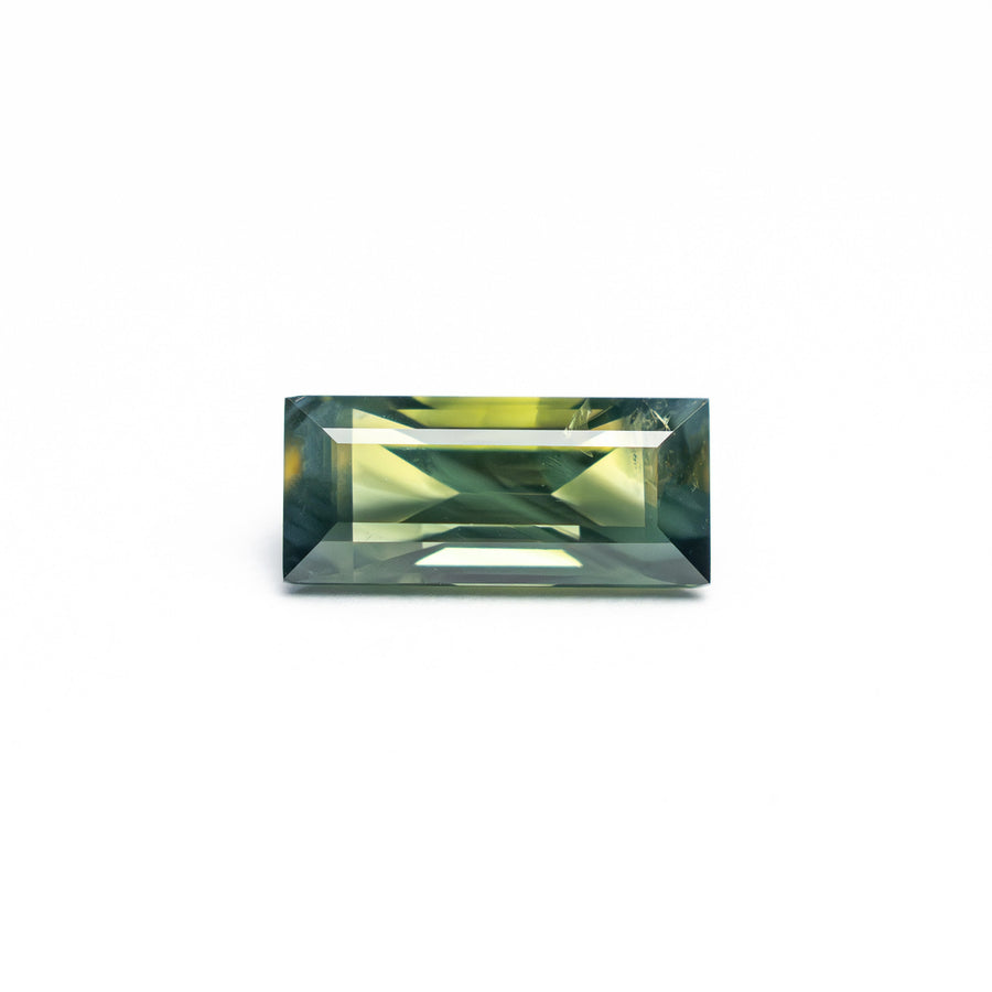 The 0.82ct 7.9x3.54x2.82mm Rectangle Step Cut Sapphire 27336-42 by East London jeweller Rachel Boston | Discover our collections of unique and timeless engagement rings, wedding rings, and modern fine jewellery. - Rachel Boston Jewellery