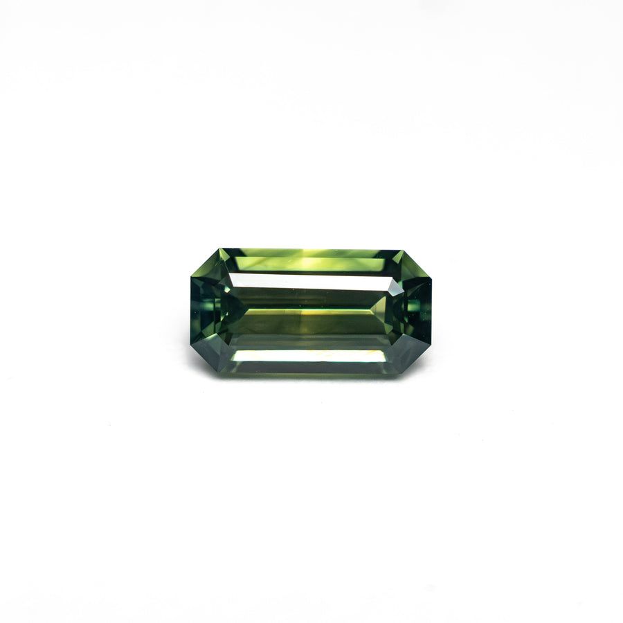 The 0.82ct 7.20x3.73x2.98mm Cut Corner Rectangle Step Cut Sapphire 27336-49 by East London jeweller Rachel Boston | Discover our collections of unique and timeless engagement rings, wedding rings, and modern fine jewellery. - Rachel Boston Jewellery