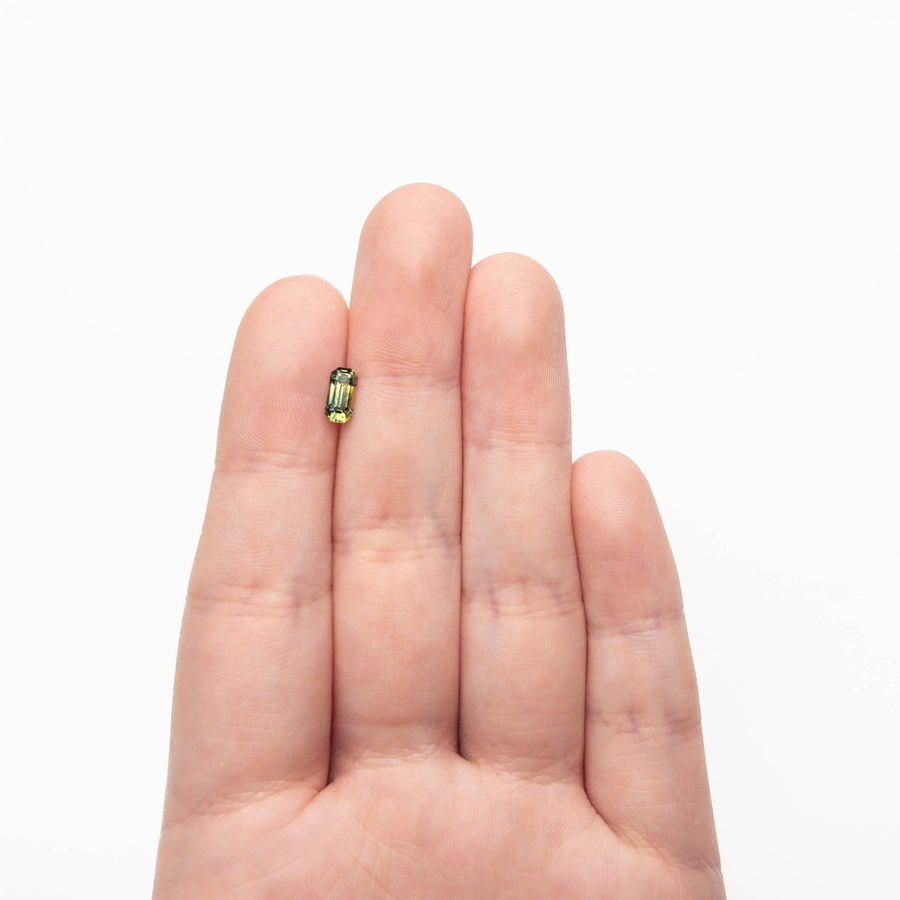 The 0.82ct 7.16x3.54x3.21mm Cut Corner Rectangle Step Cut Sapphire 27336-51 by East London jeweller Rachel Boston | Discover our collections of unique and timeless engagement rings, wedding rings, and modern fine jewellery. - Rachel Boston Jewellery