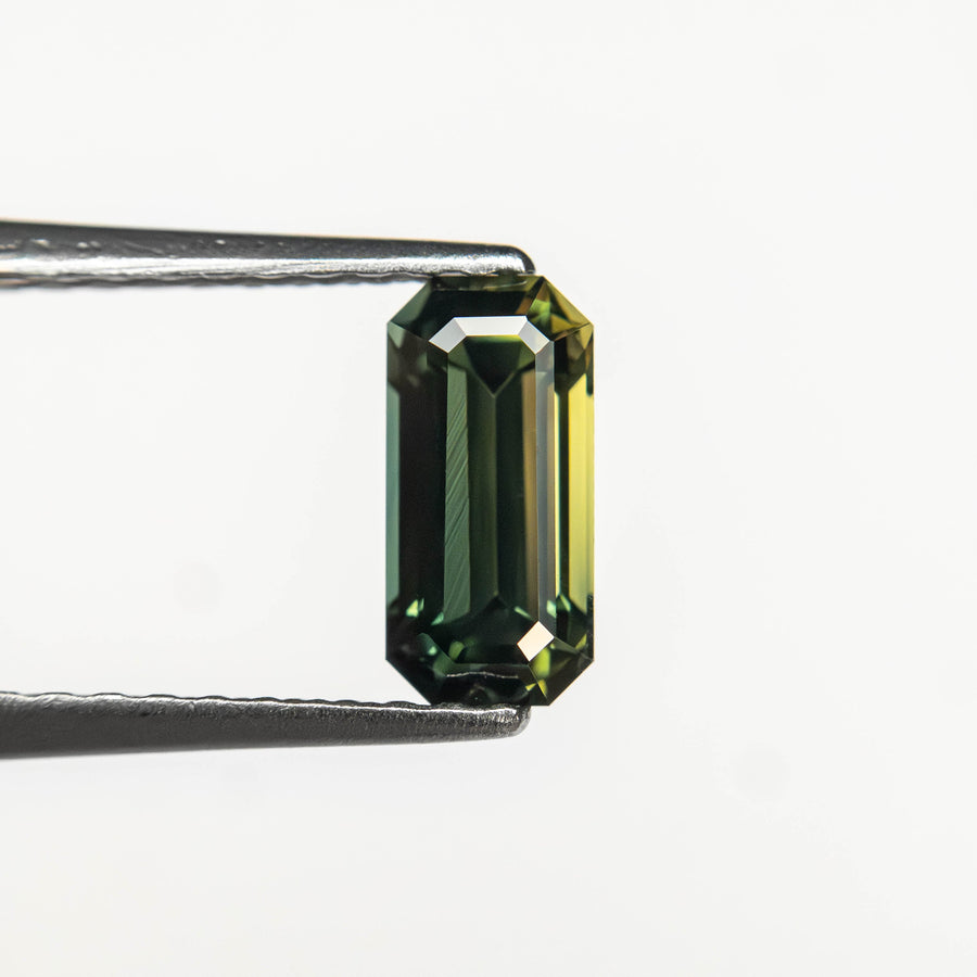 The 0.82ct 7.17x3.48x3.18mm Cut Corner Rectangle Step Cut Sapphire 27336-57 by East London jeweller Rachel Boston | Discover our collections of unique and timeless engagement rings, wedding rings, and modern fine jewellery. - Rachel Boston Jewellery