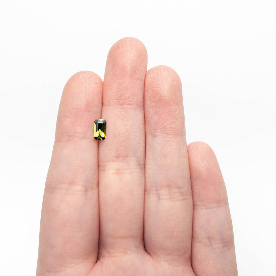 The 0.71ct 7.32x4.17x2.47mm Cut Corner Rectangle Step Cut Sapphire 27363-01 by East London jeweller Rachel Boston | Discover our collections of unique and timeless engagement rings, wedding rings, and modern fine jewellery. - Rachel Boston Jewellery