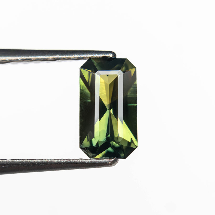 The 0.71ct 7.32x4.17x2.47mm Cut Corner Rectangle Step Cut Sapphire 27363-01 by East London jeweller Rachel Boston | Discover our collections of unique and timeless engagement rings, wedding rings, and modern fine jewellery. - Rachel Boston Jewellery