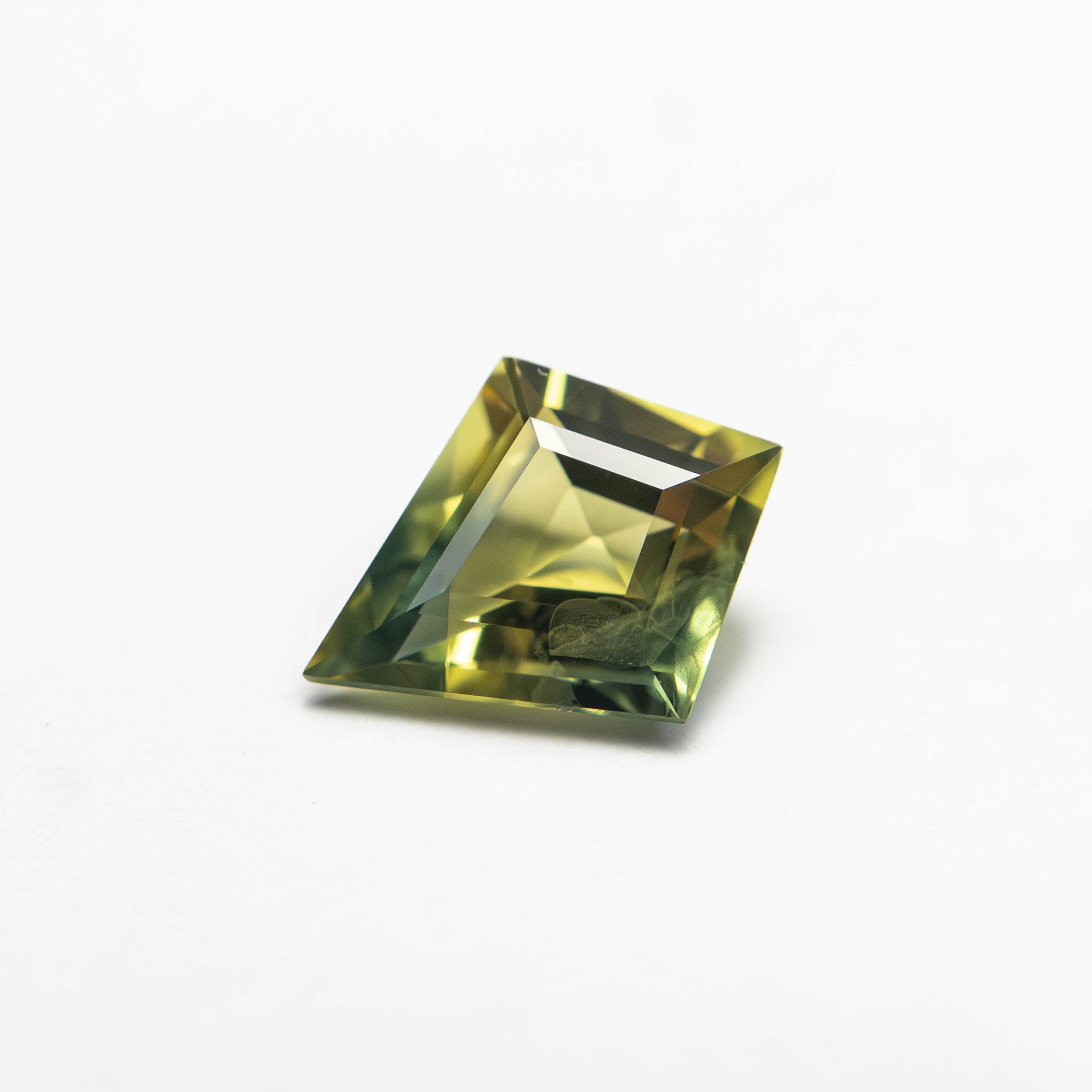 The 0.81ct 7.98x6.34x3.11mm Kite Step Cut Sapphire 27363-11 by East London jeweller Rachel Boston | Discover our collections of unique and timeless engagement rings, wedding rings, and modern fine jewellery.
