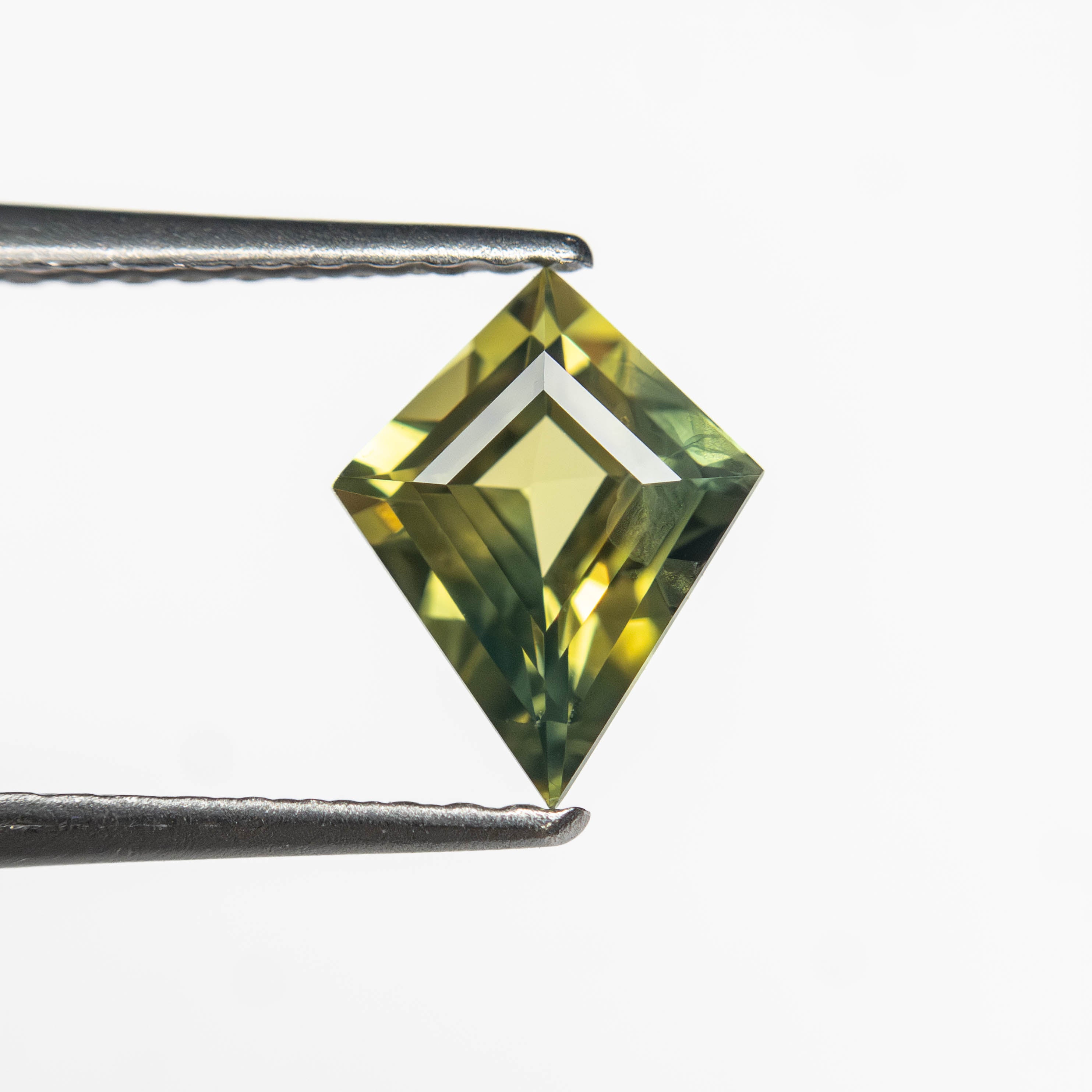 The 0.81ct 7.98x6.34x3.11mm Kite Step Cut Sapphire 27363-11 by East London jeweller Rachel Boston | Discover our collections of unique and timeless engagement rings, wedding rings, and modern fine jewellery.