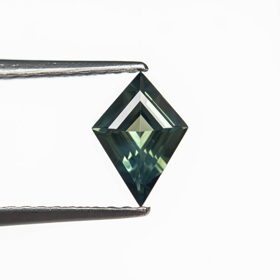 The 0.54ct 7.68x5.44x2.64mm Kite Step Cut Sapphire 27363-14 by East London jeweller Rachel Boston | Discover our collections of unique and timeless engagement rings, wedding rings, and modern fine jewellery. - Rachel Boston Jewellery