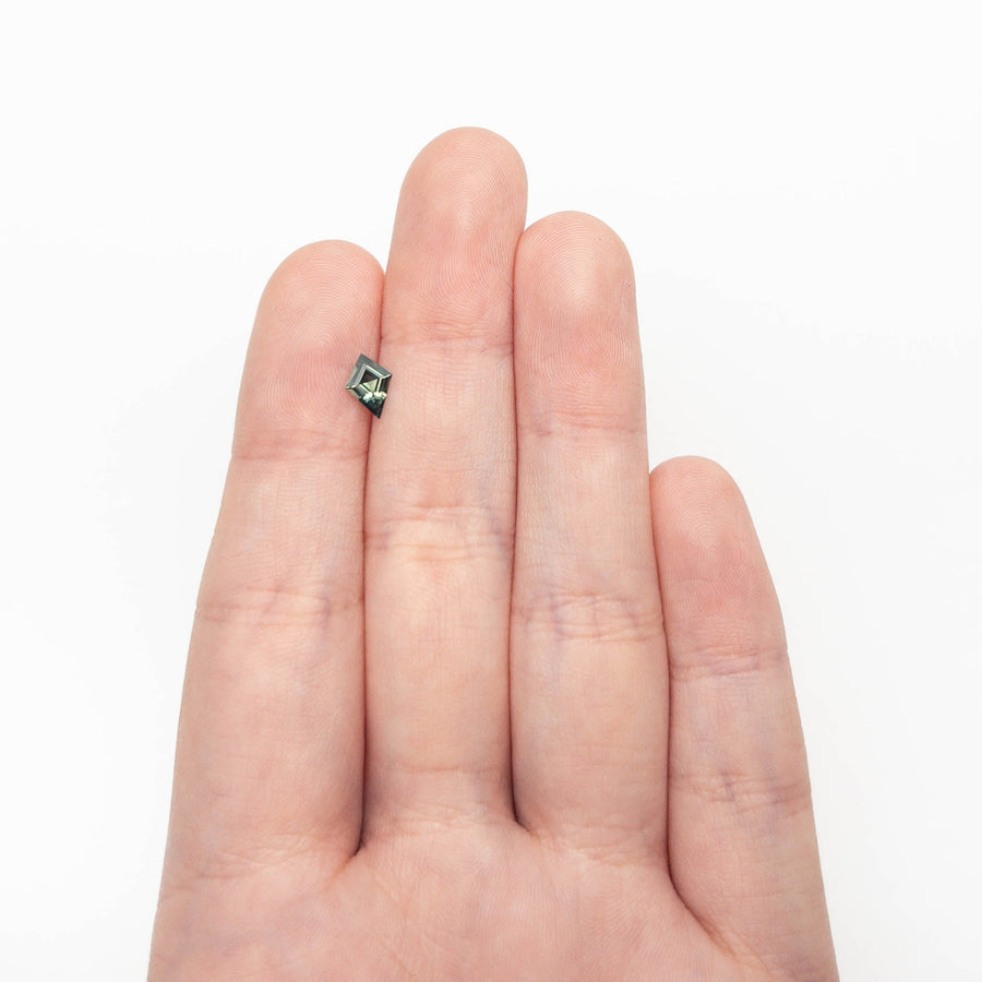 The 0.54ct 7.68x5.44x2.64mm Kite Step Cut Sapphire 27363-14 by East London jeweller Rachel Boston | Discover our collections of unique and timeless engagement rings, wedding rings, and modern fine jewellery. - Rachel Boston Jewellery