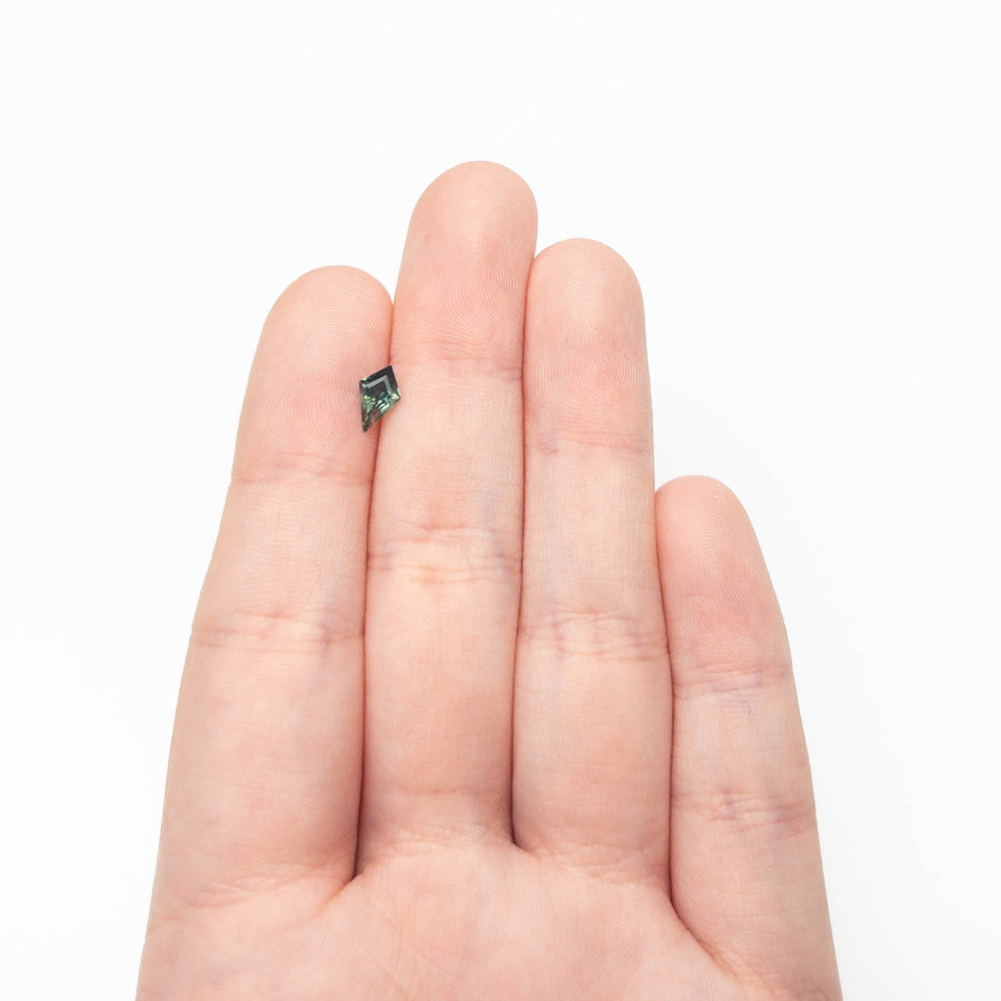 The 0.67ct 8.12x4.94x3.15mm Kite Step Cut Sapphire 27363-15 by East London jeweller Rachel Boston | Discover our collections of unique and timeless engagement rings, wedding rings, and modern fine jewellery. - Rachel Boston Jewellery