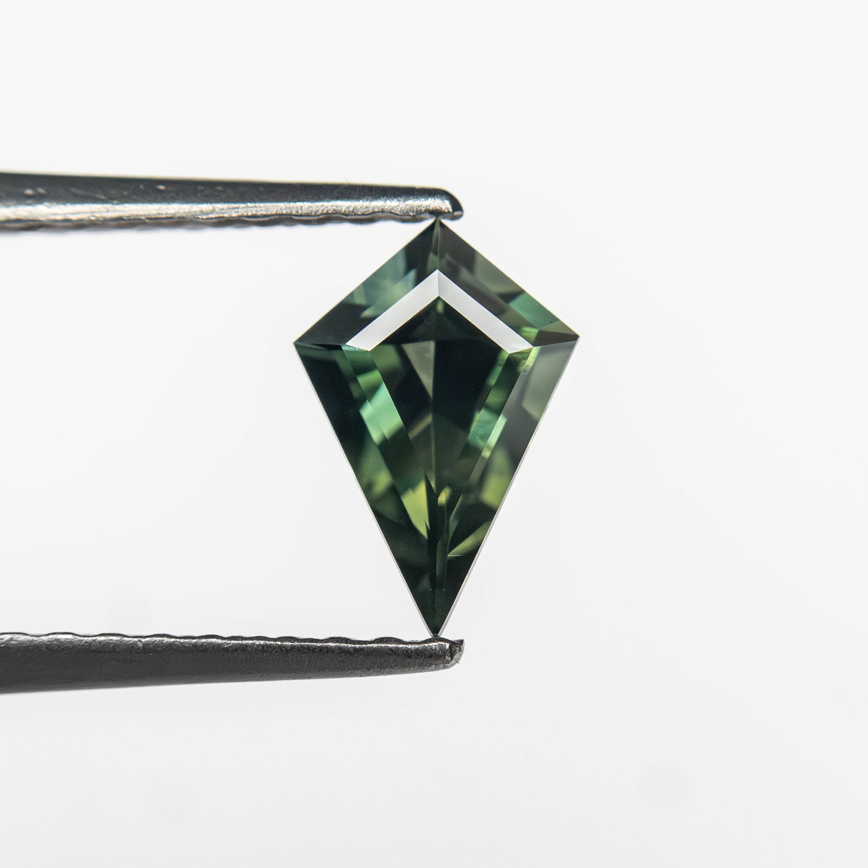 The 0.50ct 7.34x4.96x2.87mm Kite Step Cut Sapphire 27363-16 by East London jeweller Rachel Boston | Discover our collections of unique and timeless engagement rings, wedding rings, and modern fine jewellery.
